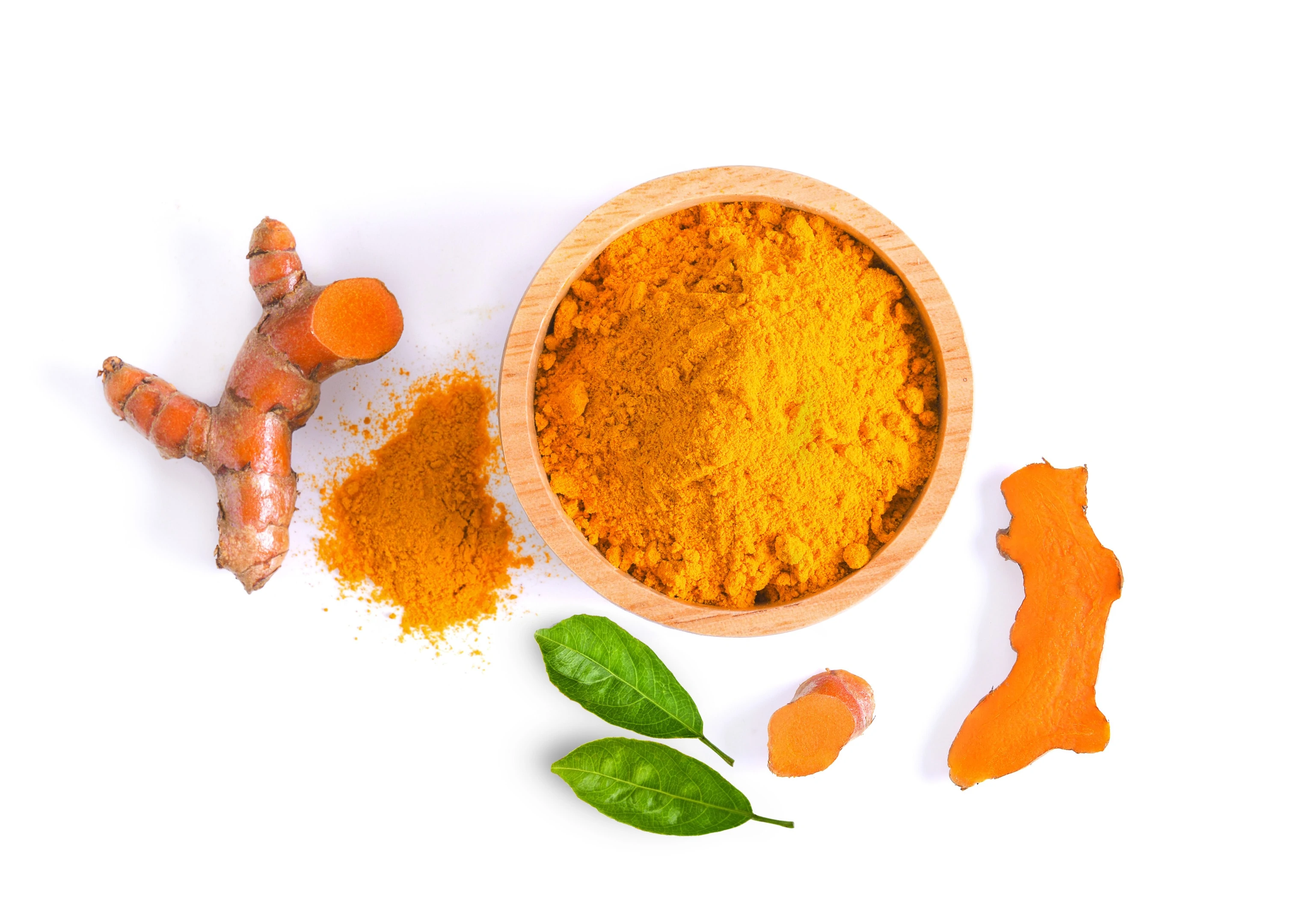 Turmeric root and powder on white background