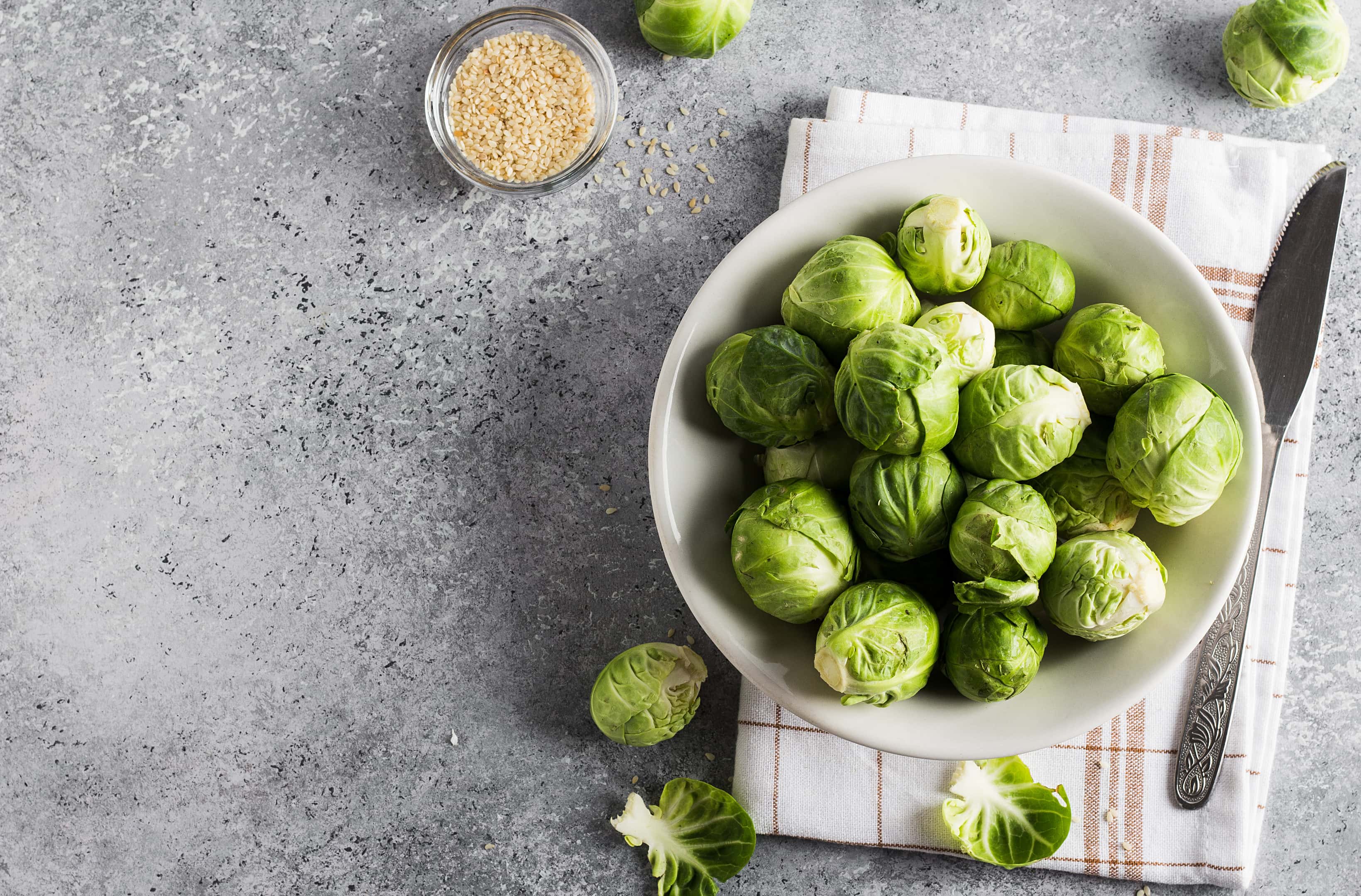 Brussels sprouts cabbage in ceramic plate on kitchen table