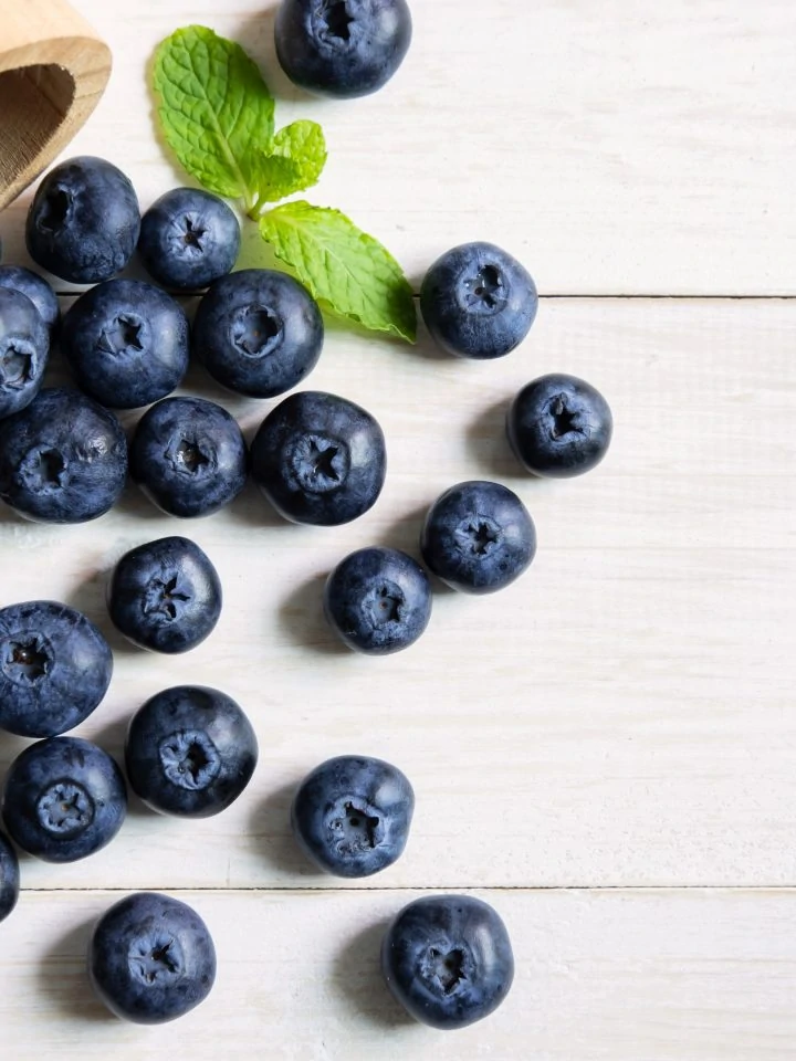 Fresh blueberries on white wooden table