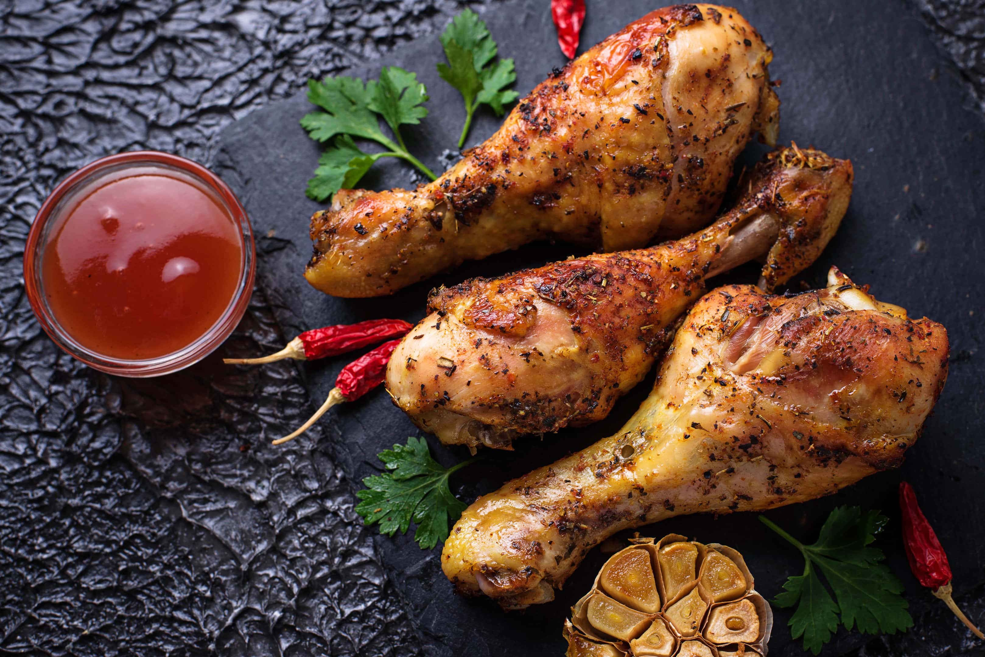Grilled chicken legs with spices and garlic