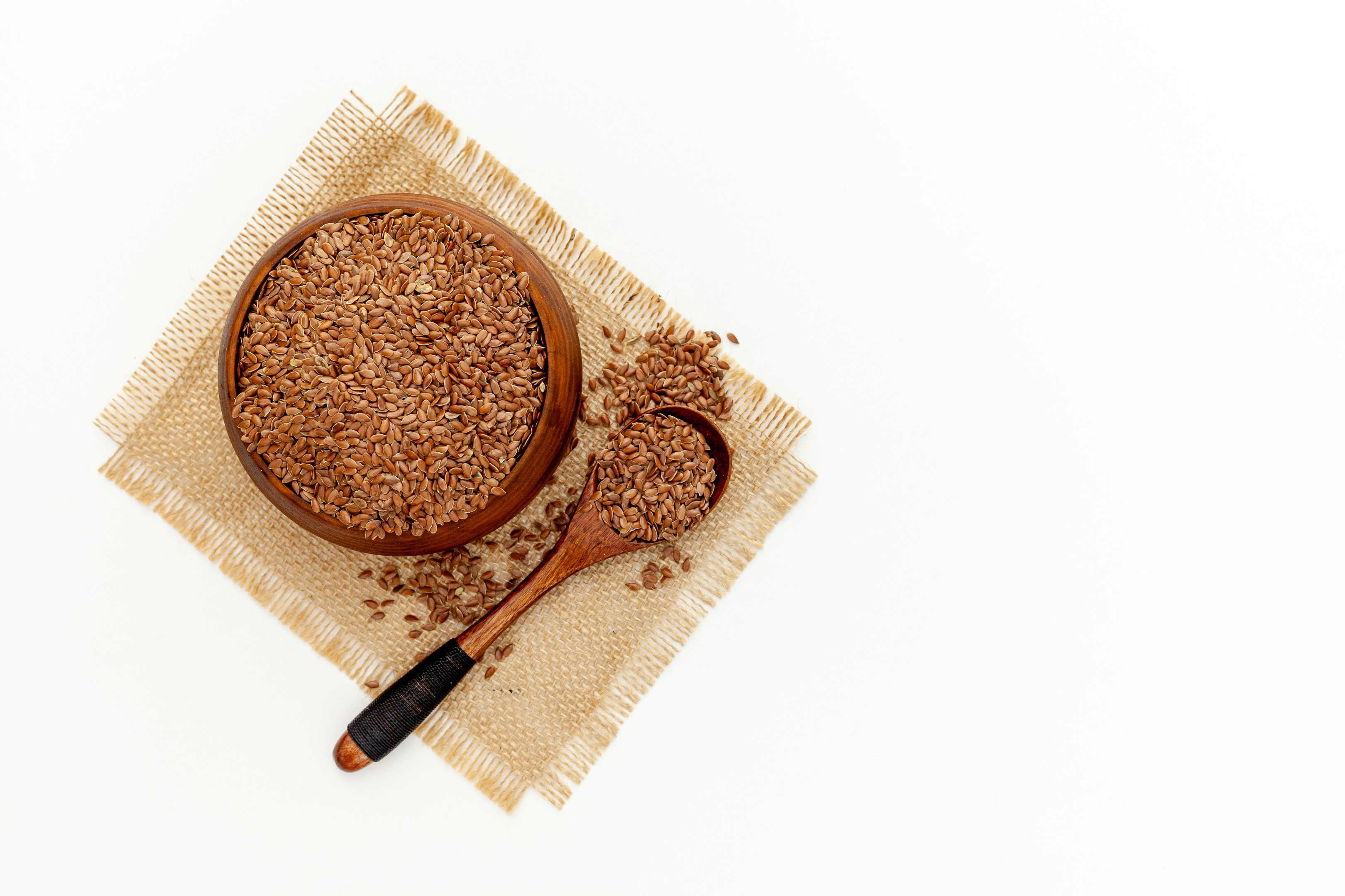 Flax Seeds in Wooden Spoon and Bowl