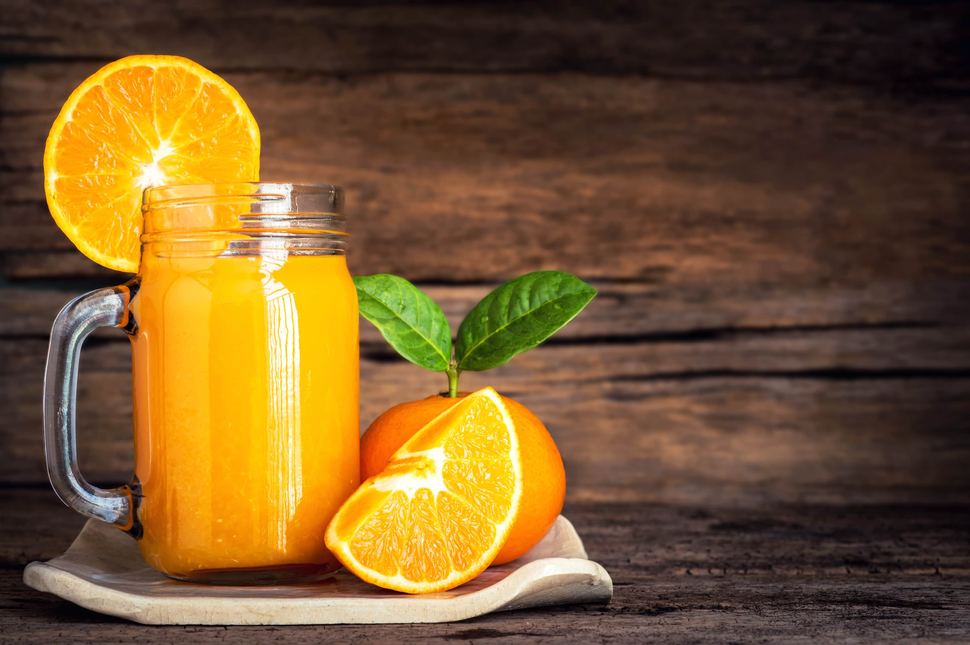 Orange Juice in Glass With Fresh Orange