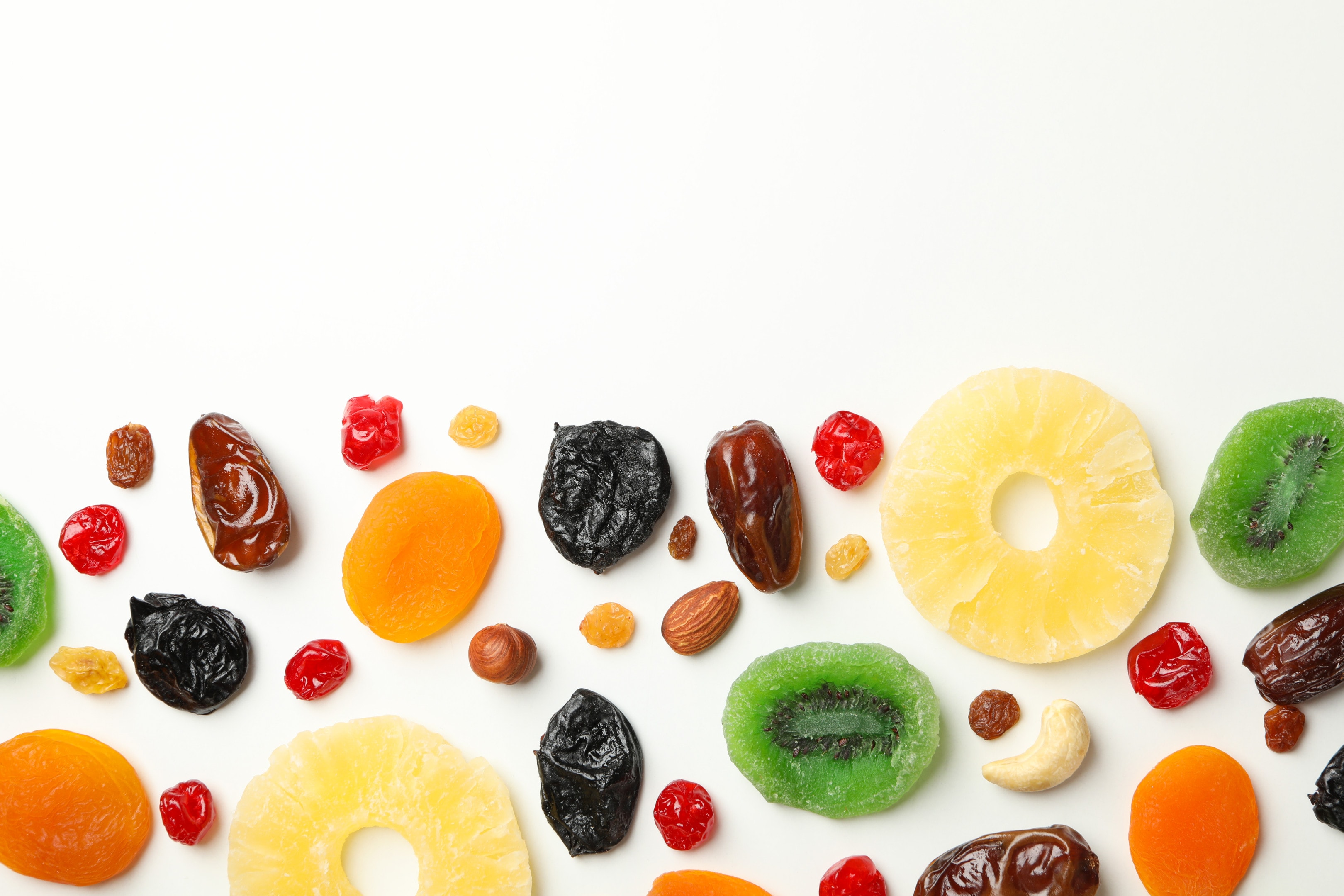 Tasty dried fruits on white table