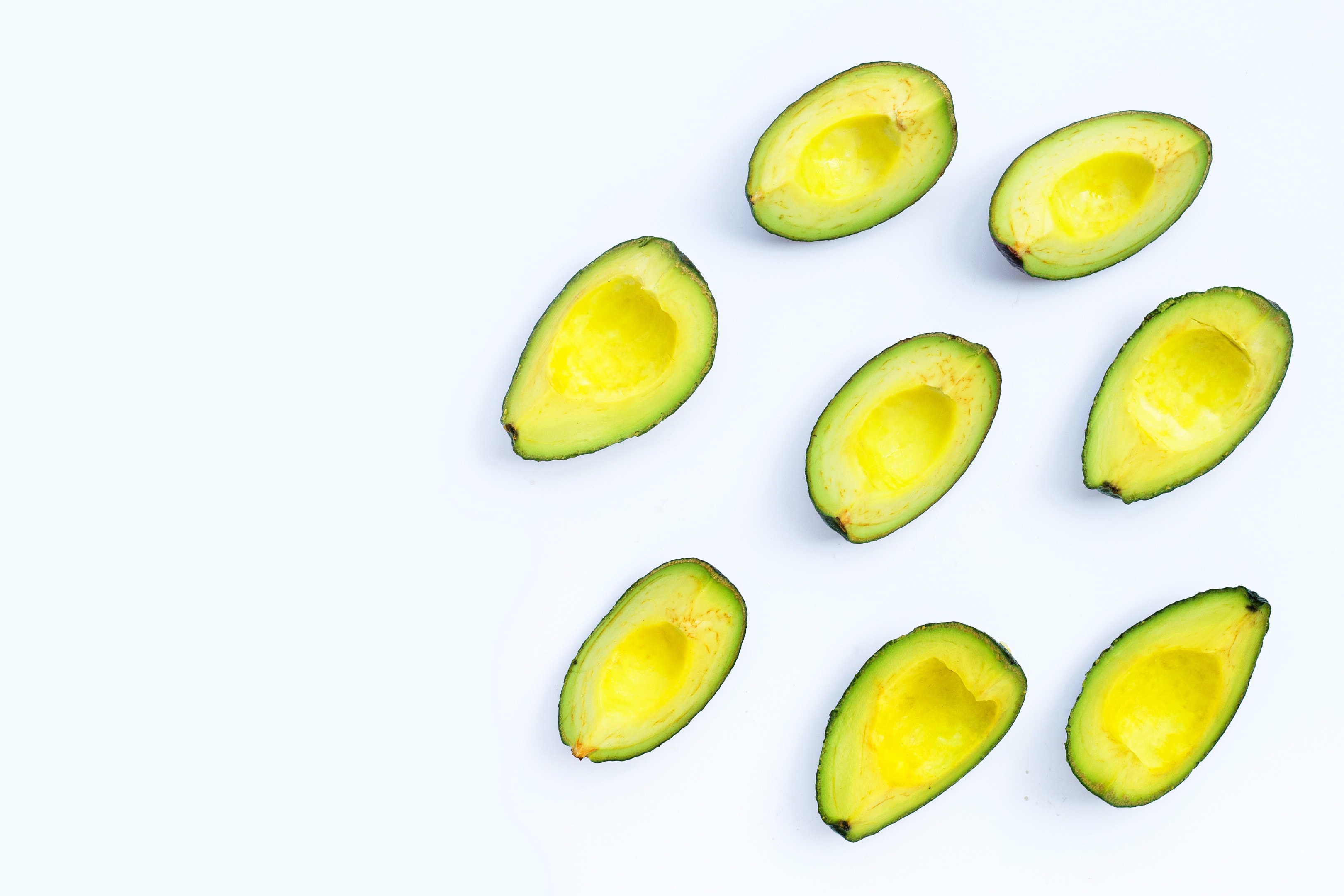 Avocados on white background