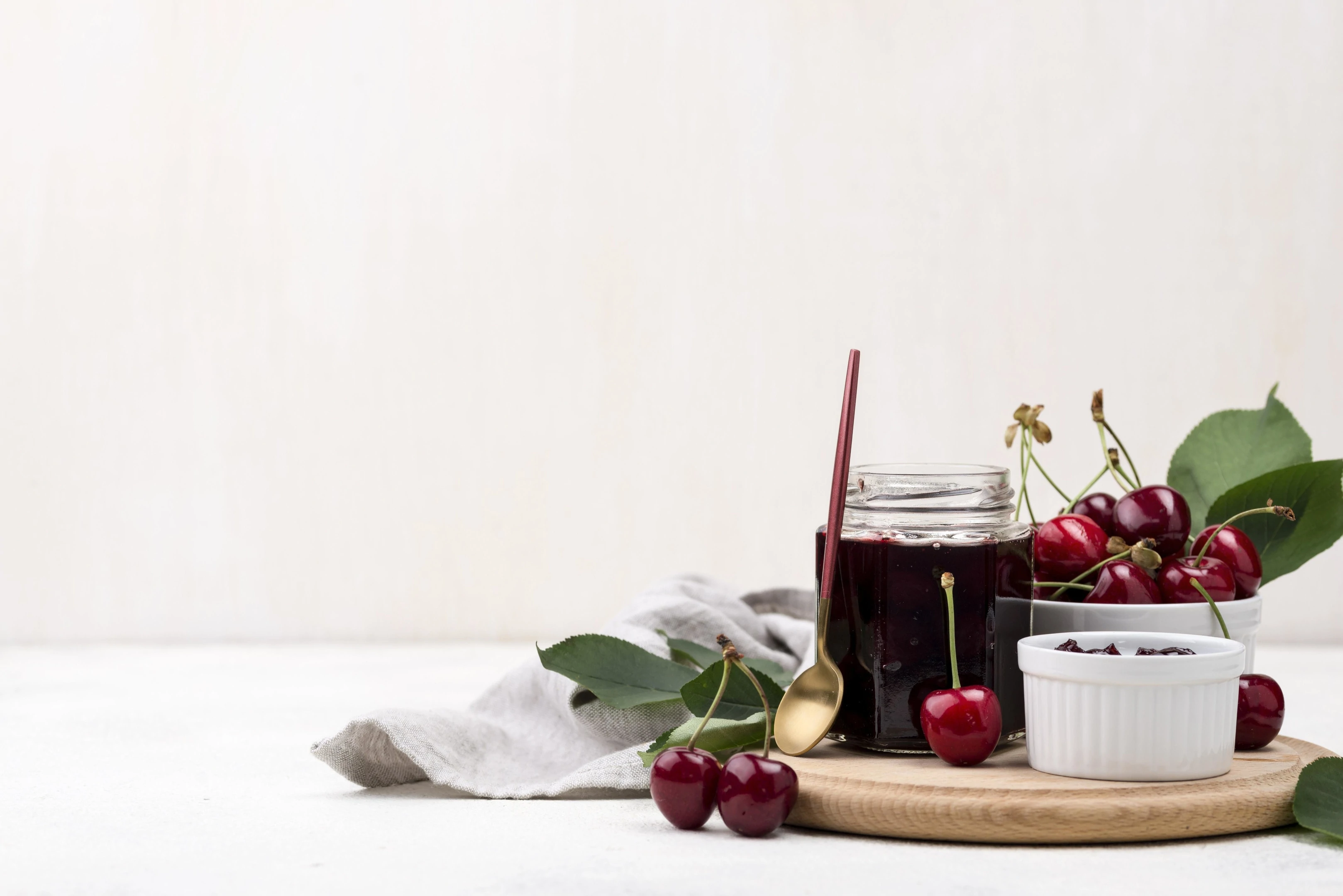 Fresh cherries, cherry jam and cherry juice. Cherries are one of the best low fiber vegan foods.