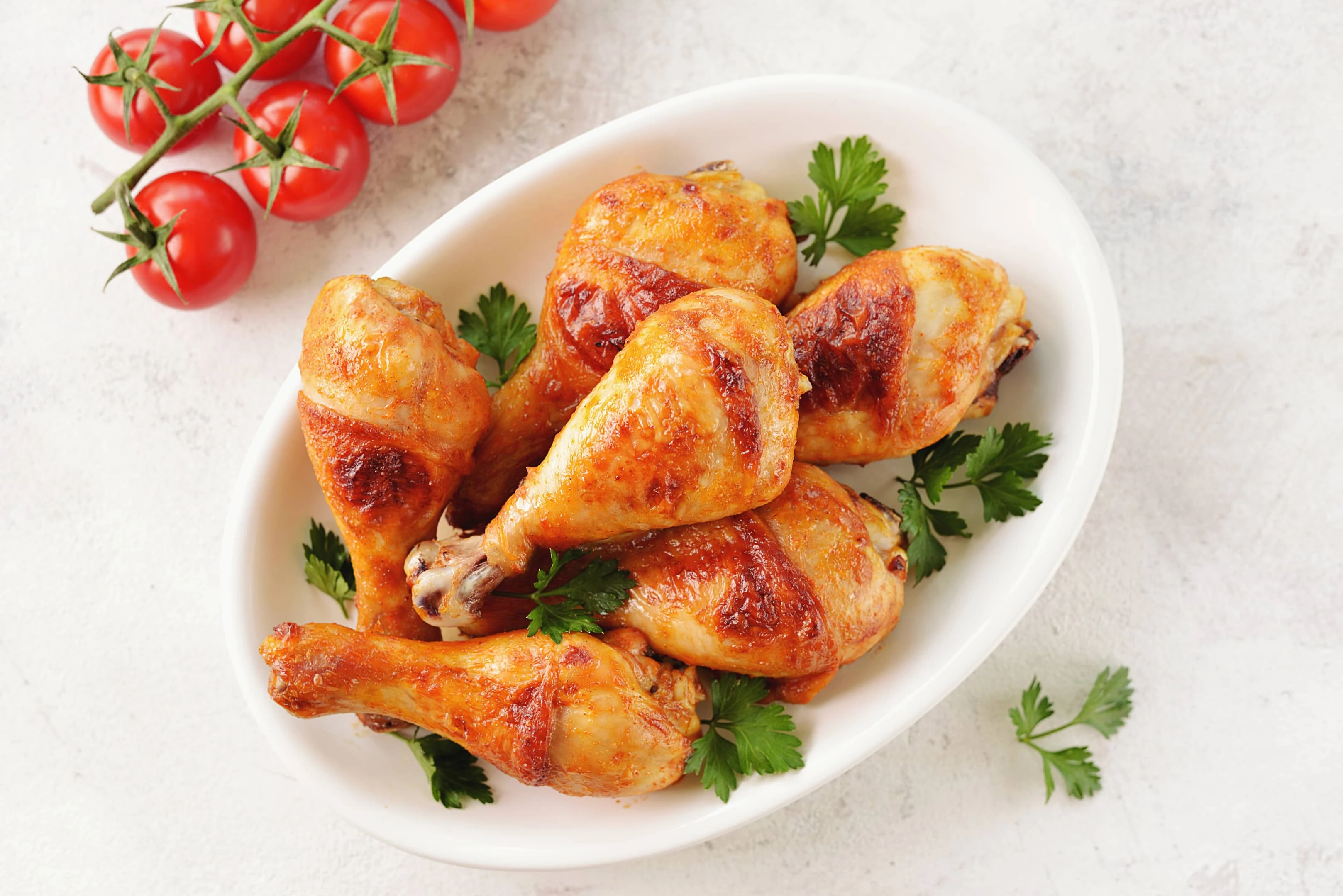 Chicken drumsticks baked with tomato sauce soy sauce and olive oil