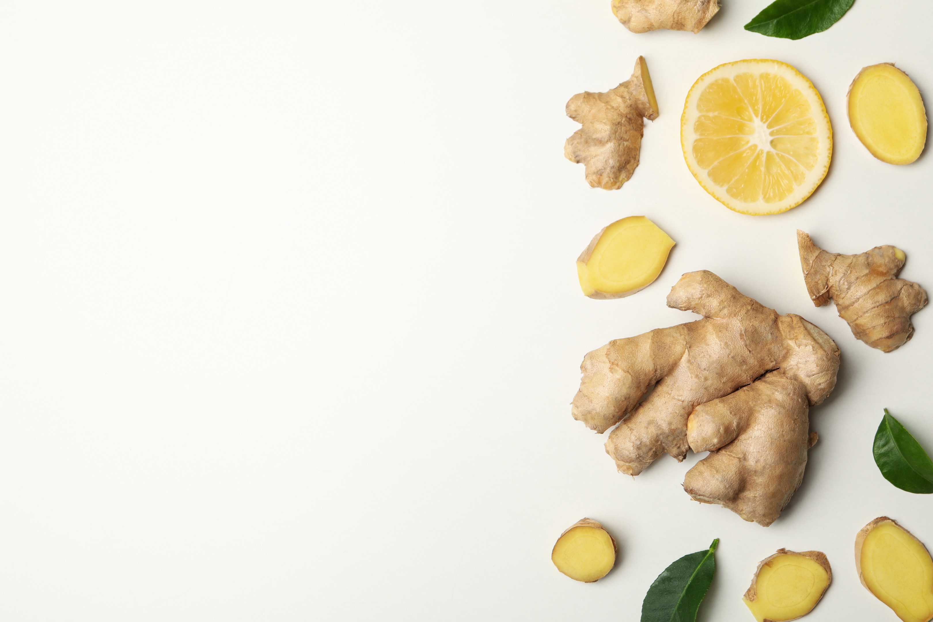 Fresh ginger and lemon on white background
