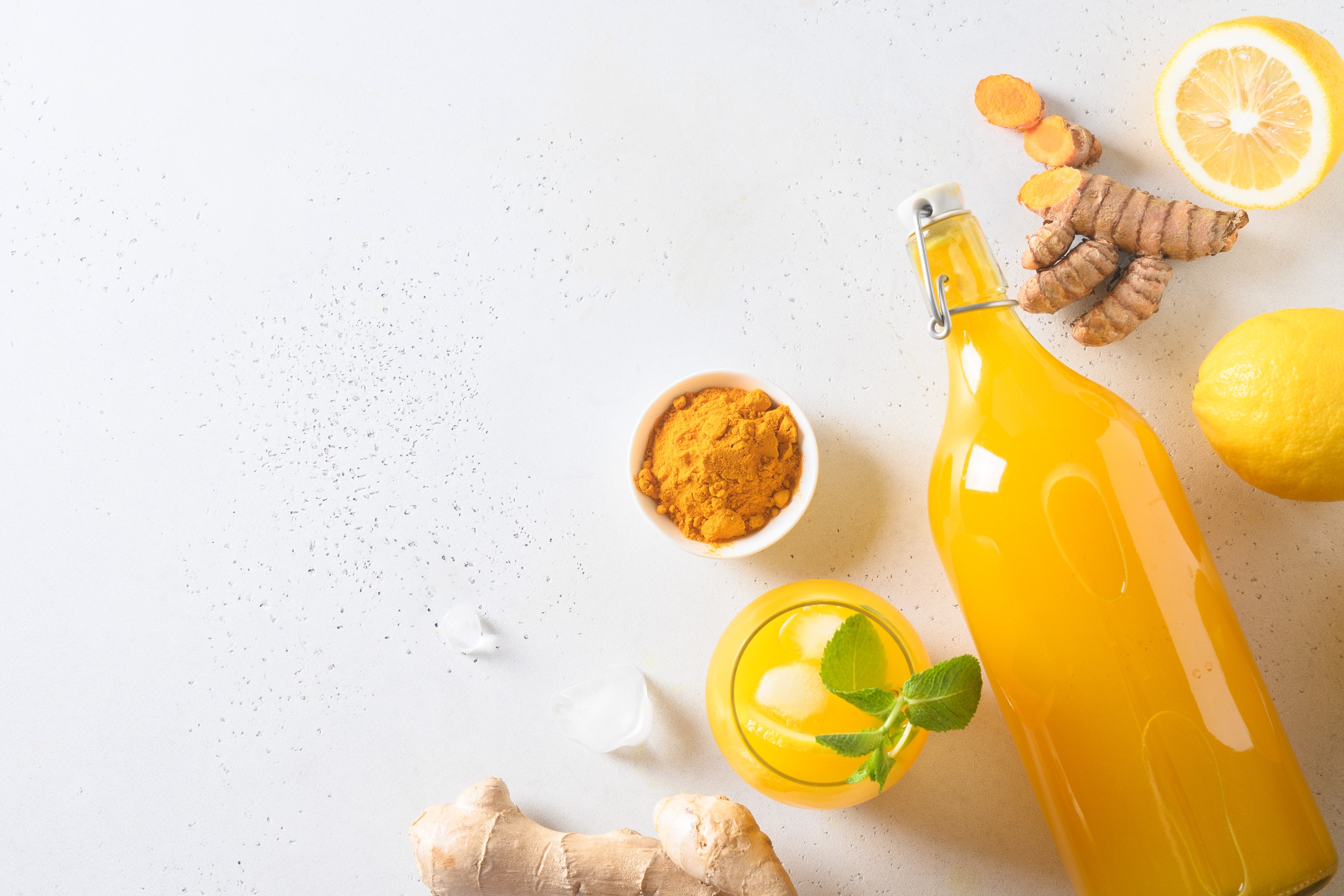 Jamu Indonesian herbal beverage with turmeric and ginger on white background