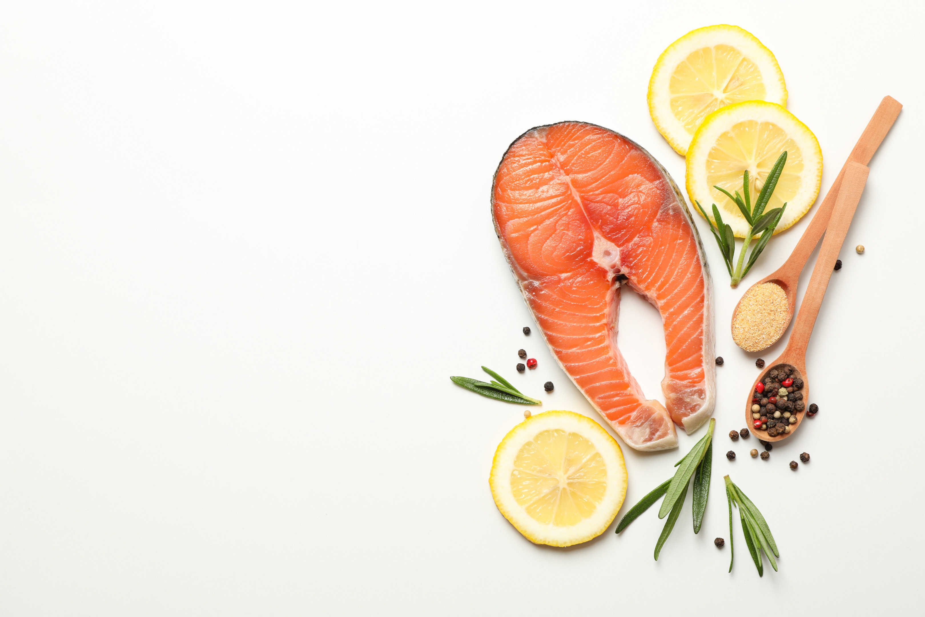 Salmon and spices on white background