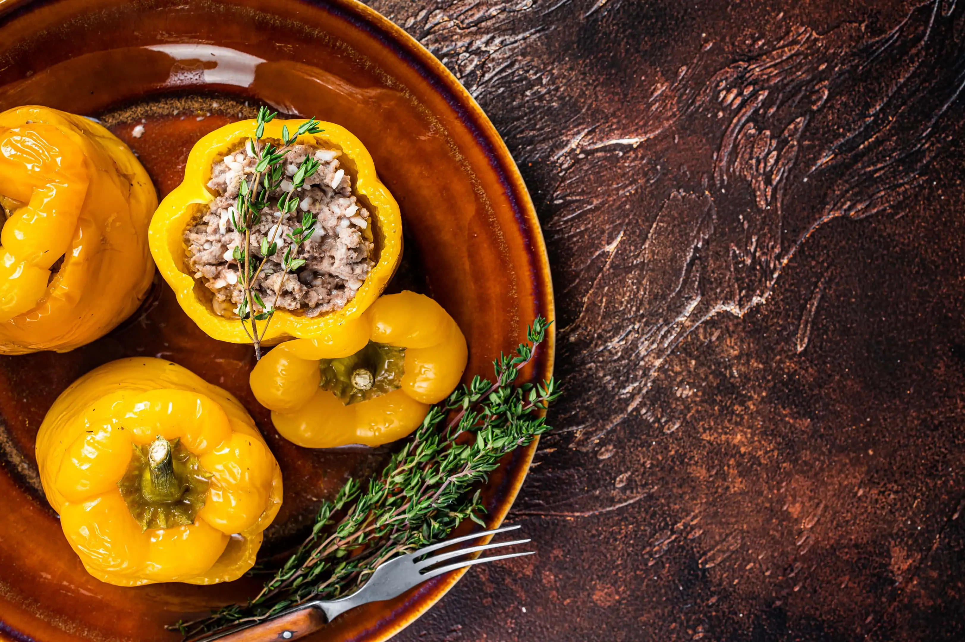 Baked sweet bell pepper stuffed with beef meat rice and vegetables