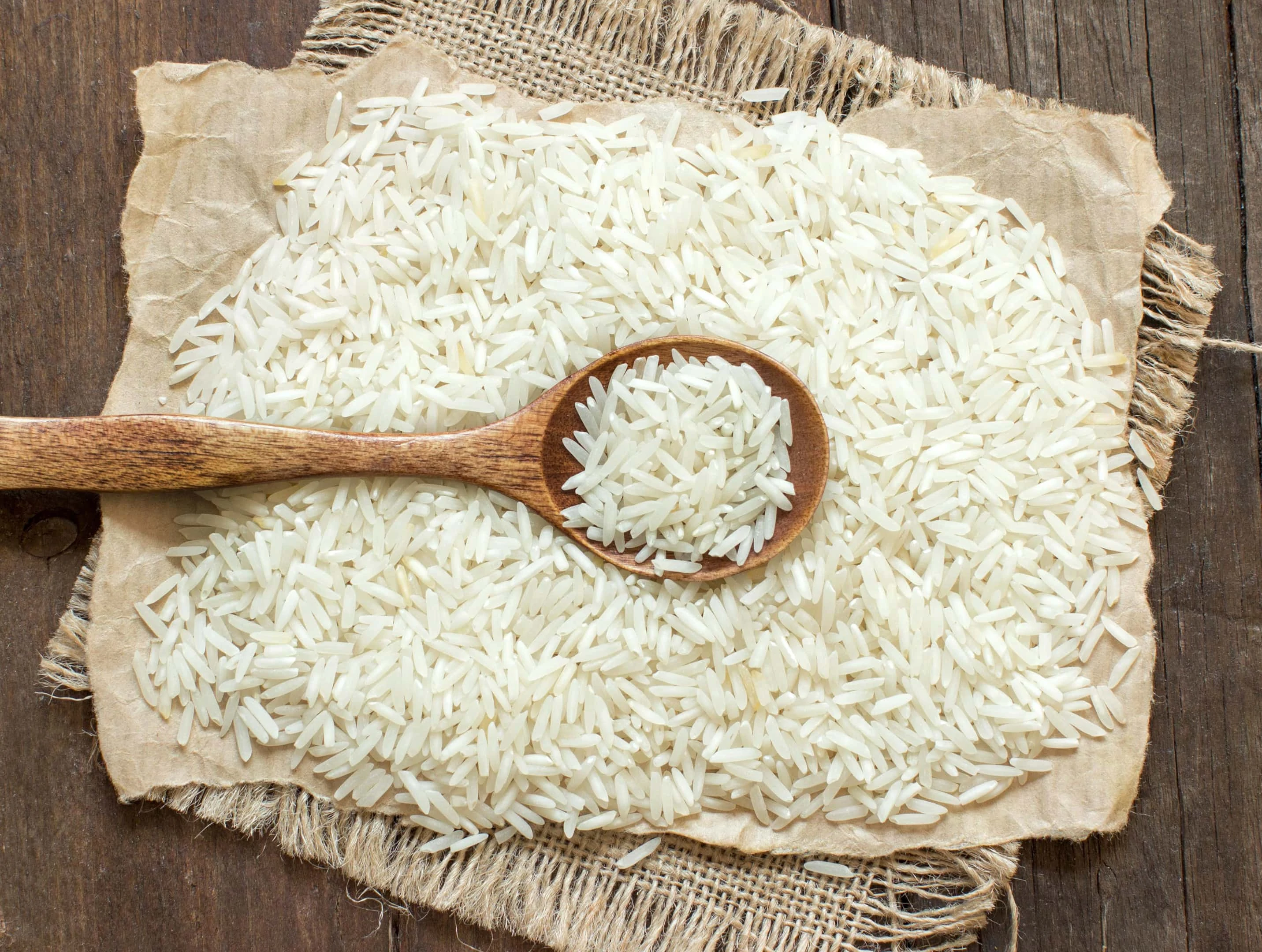 Basmati rice with brown wooden spoon