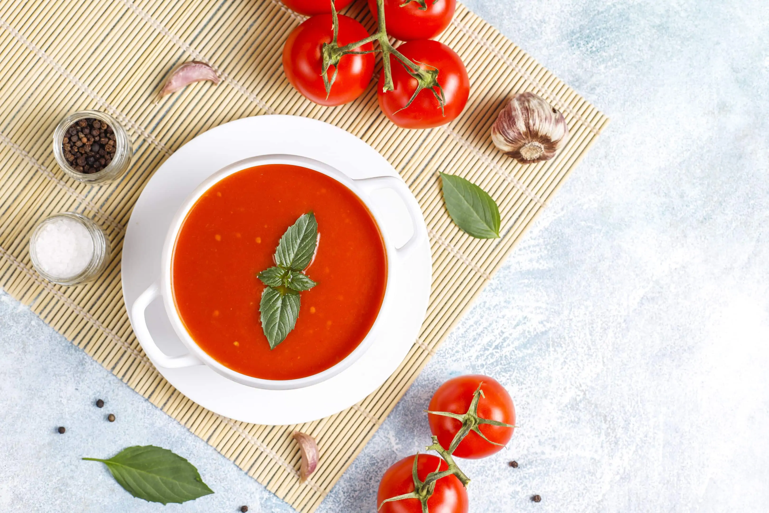 Bowl of tomato soup with basil