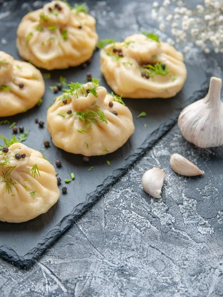 Garlic dumplings on cutting board
