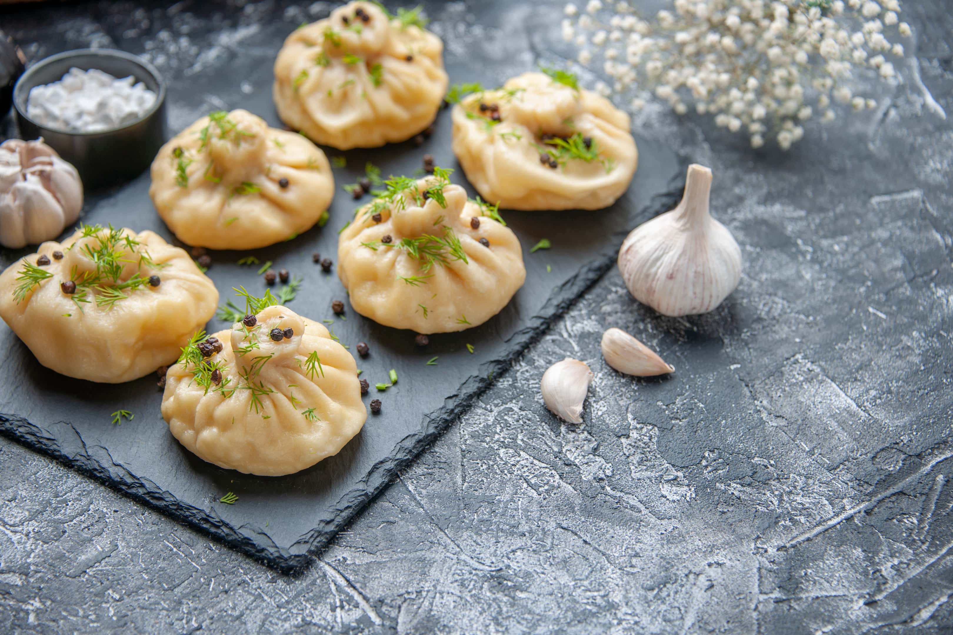Garlic dumplings on cutting board