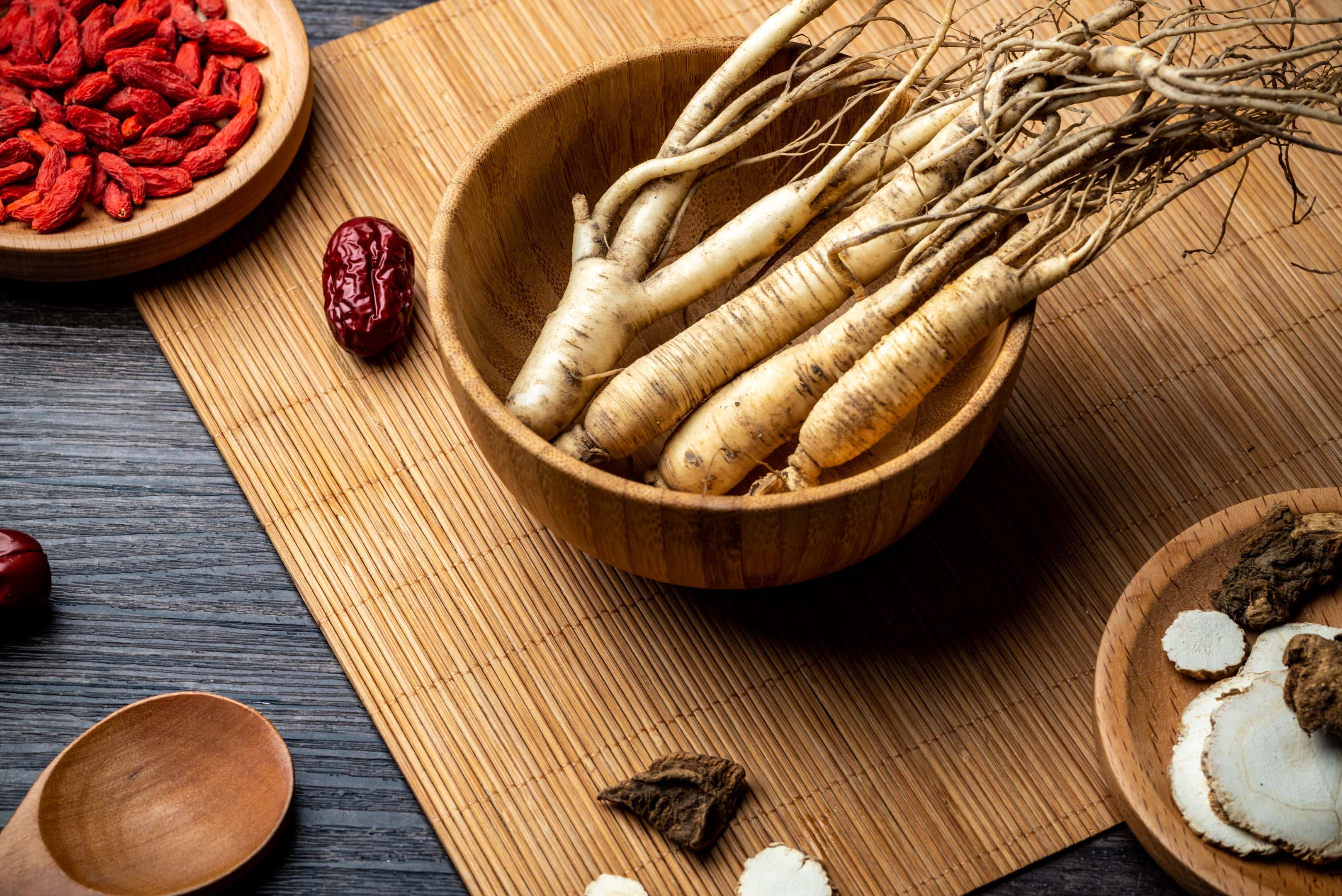 Ginseng wolfberry and jujube in wooden bowl