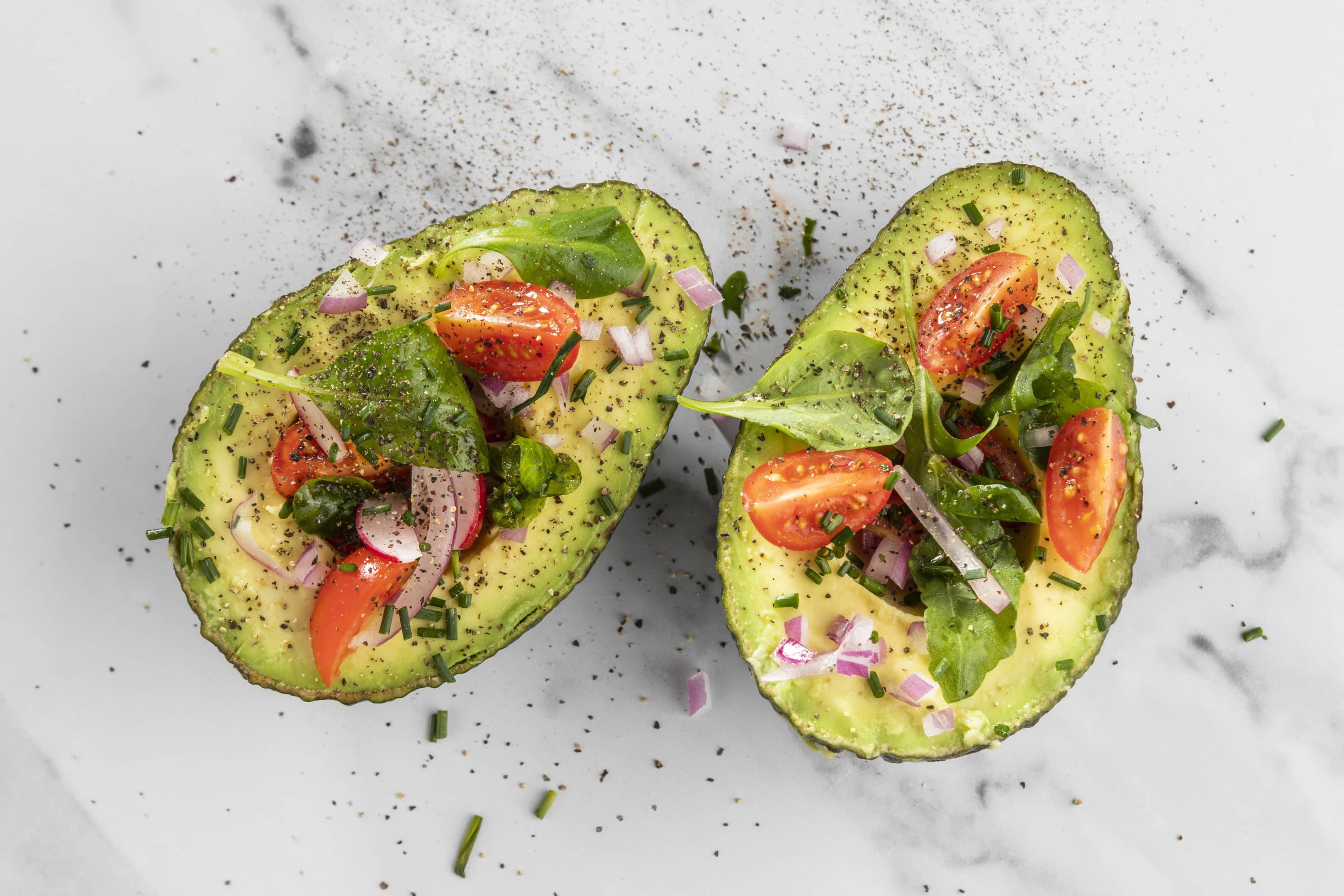 Healthy salad in avocado composition