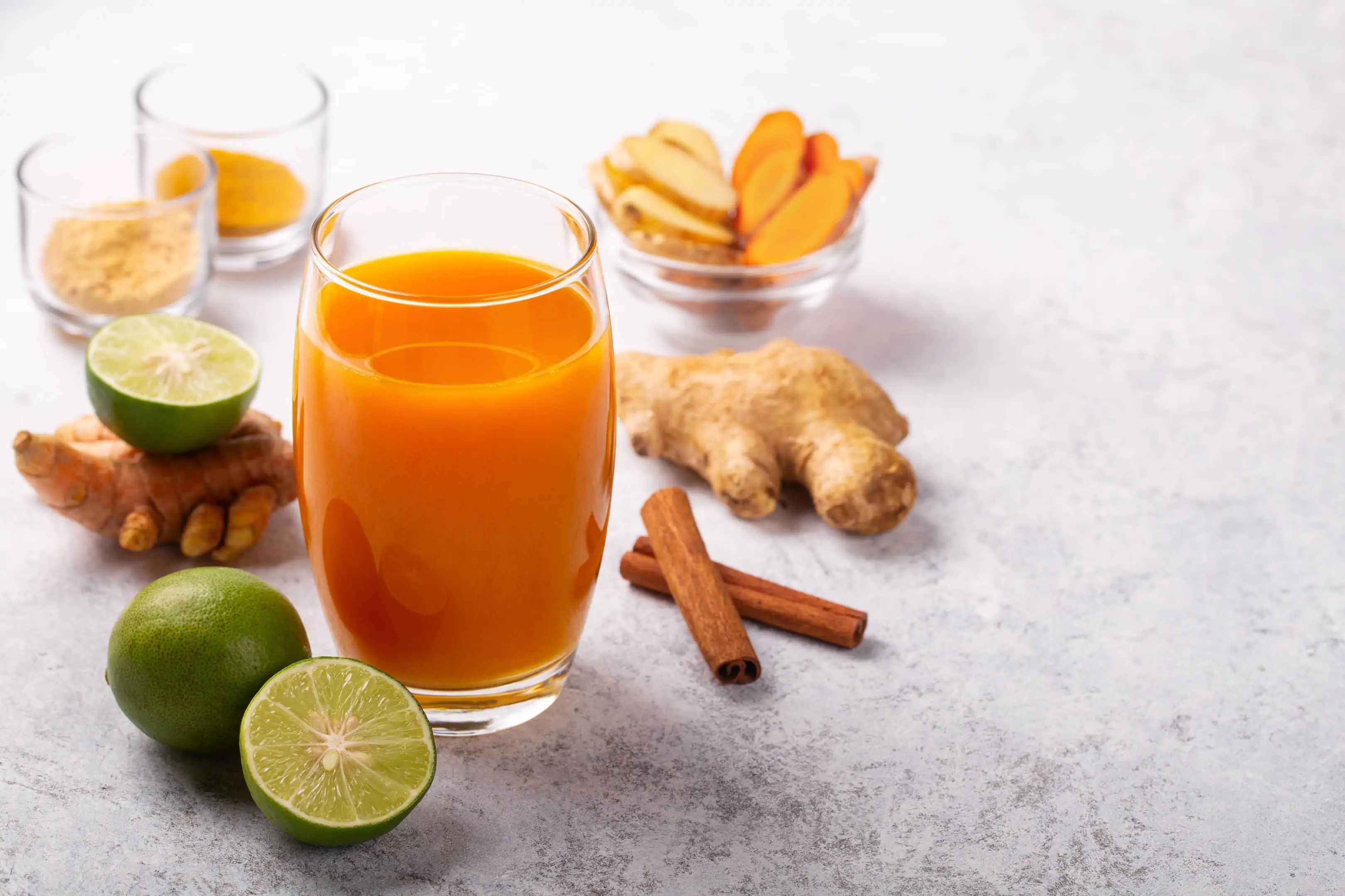 Healthy turmeric tamarind and ginger drink with lime