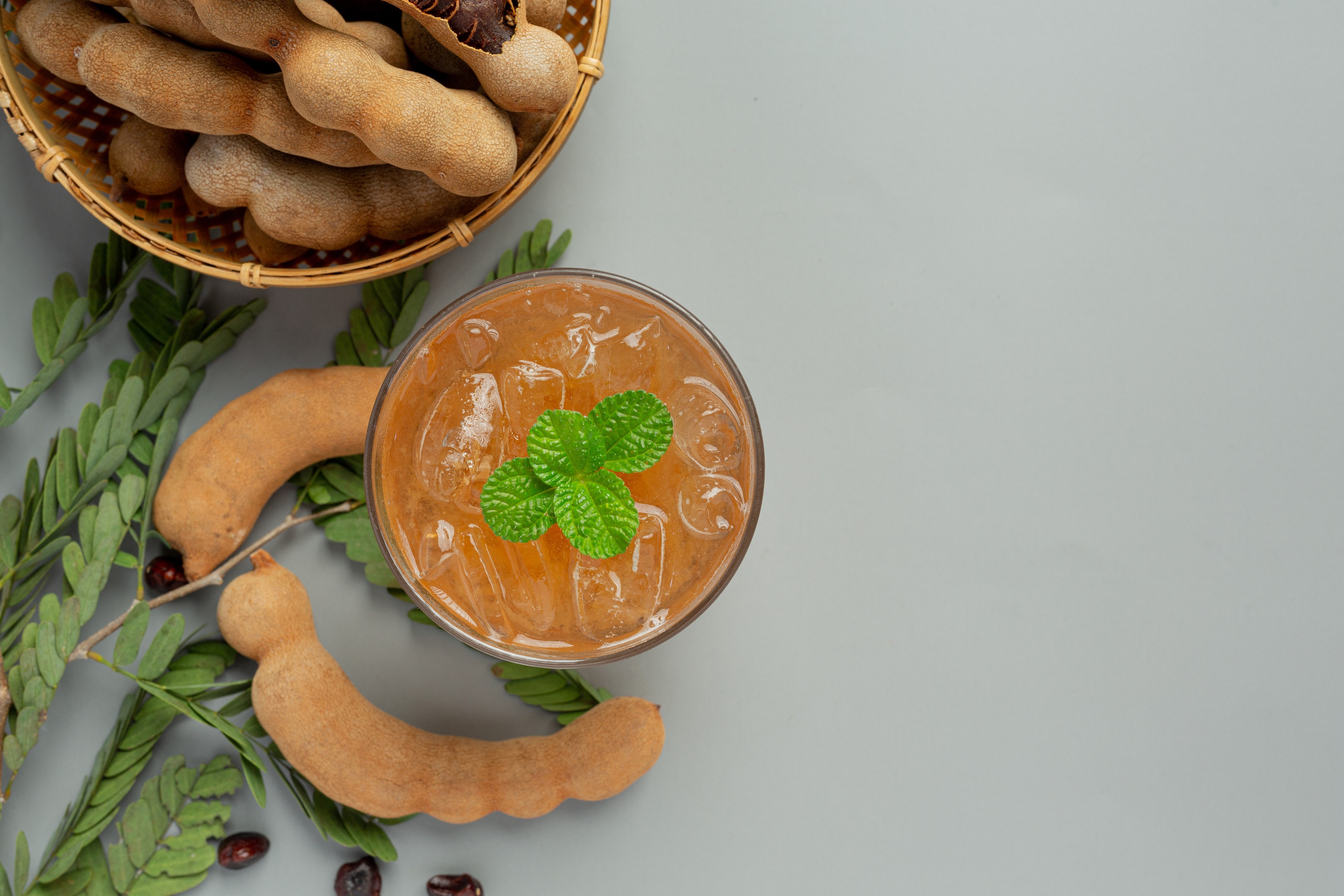 Tamarind turmeric drink on gray table