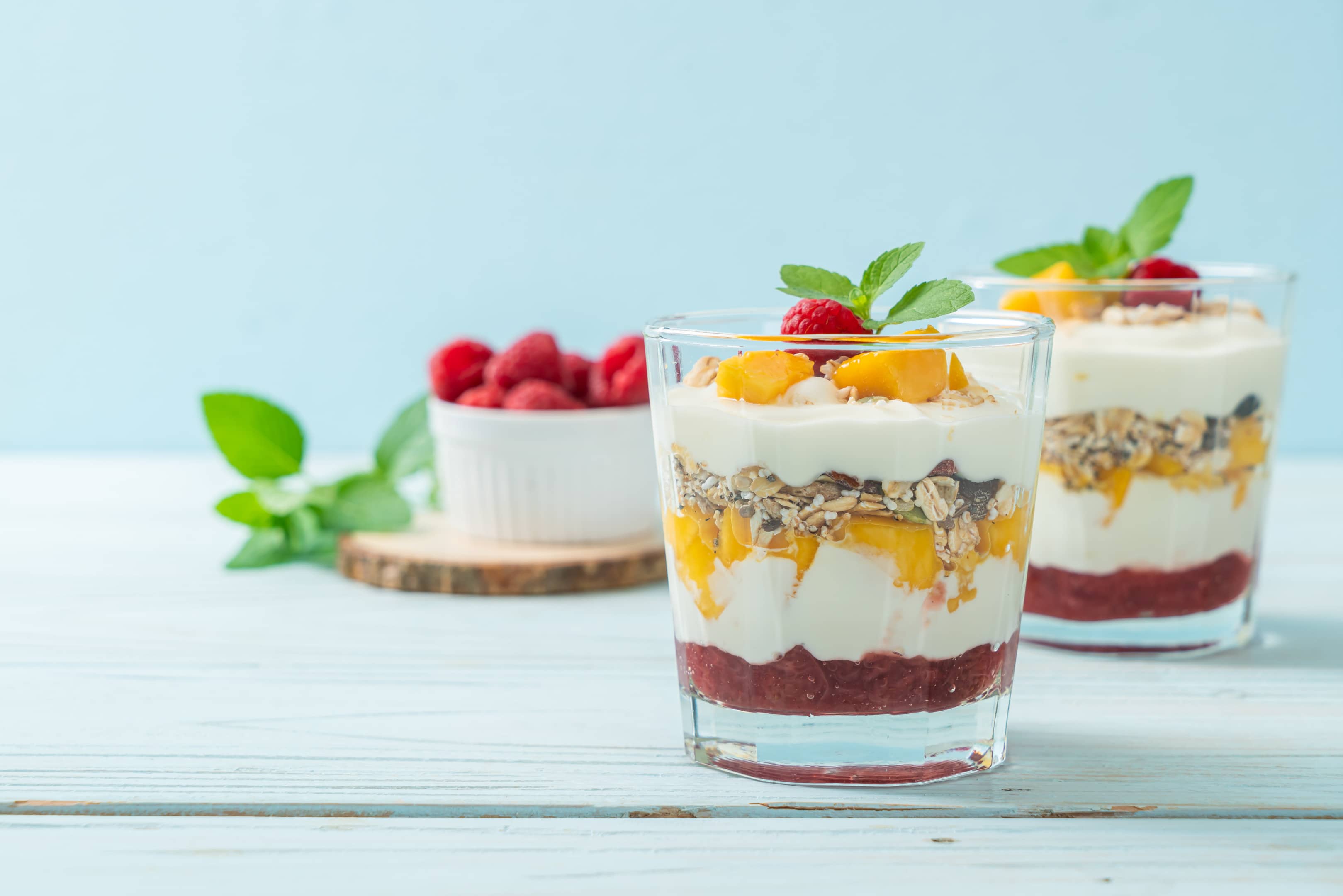 Low-fat yogurt granola with fresh apricot raspberry and cranberries