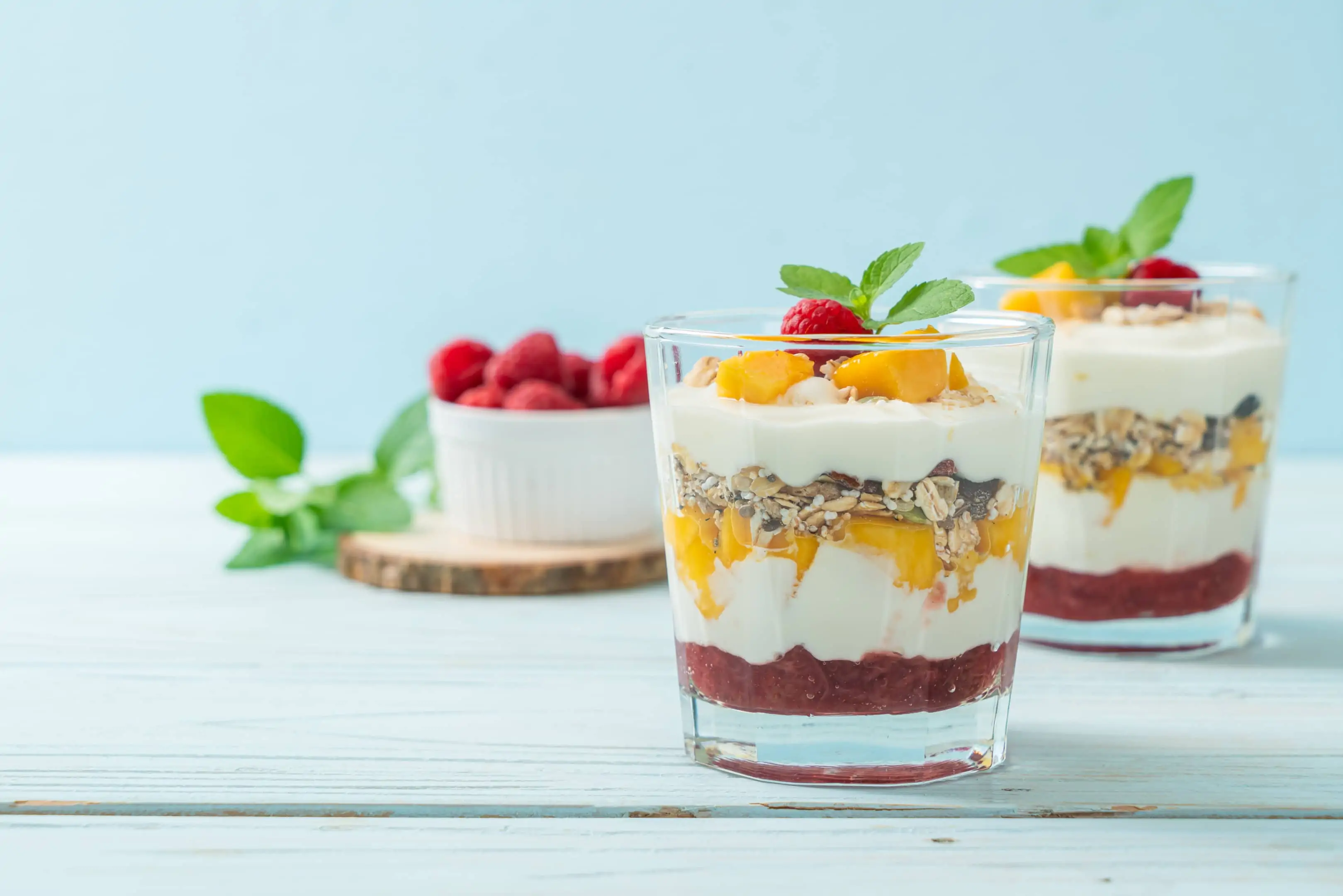 Low-fat yogurt granola with fresh apricot raspberry and cranberries