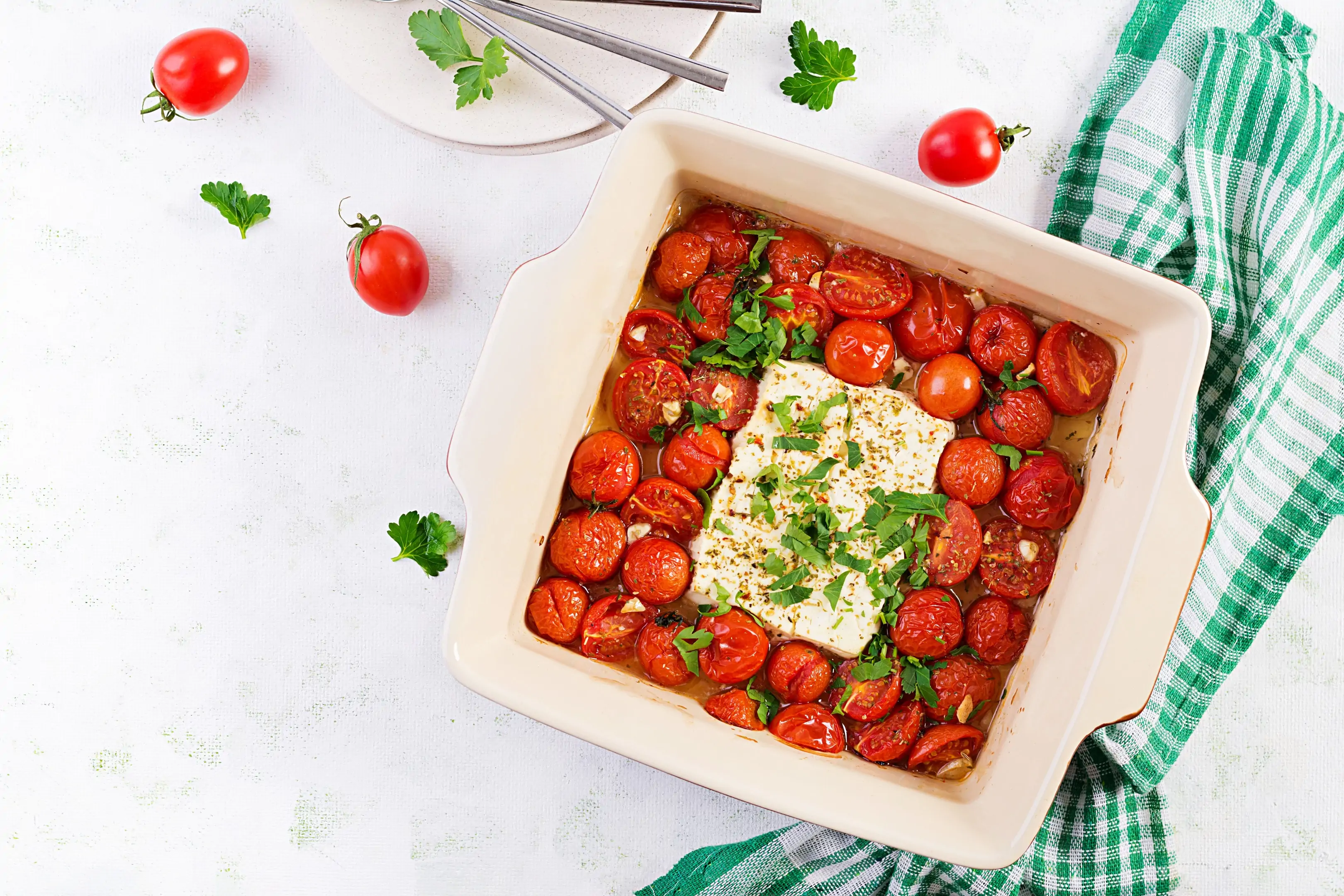 Baked cherry tomatoes, feta cheese, garlic, herbs and olive oil
