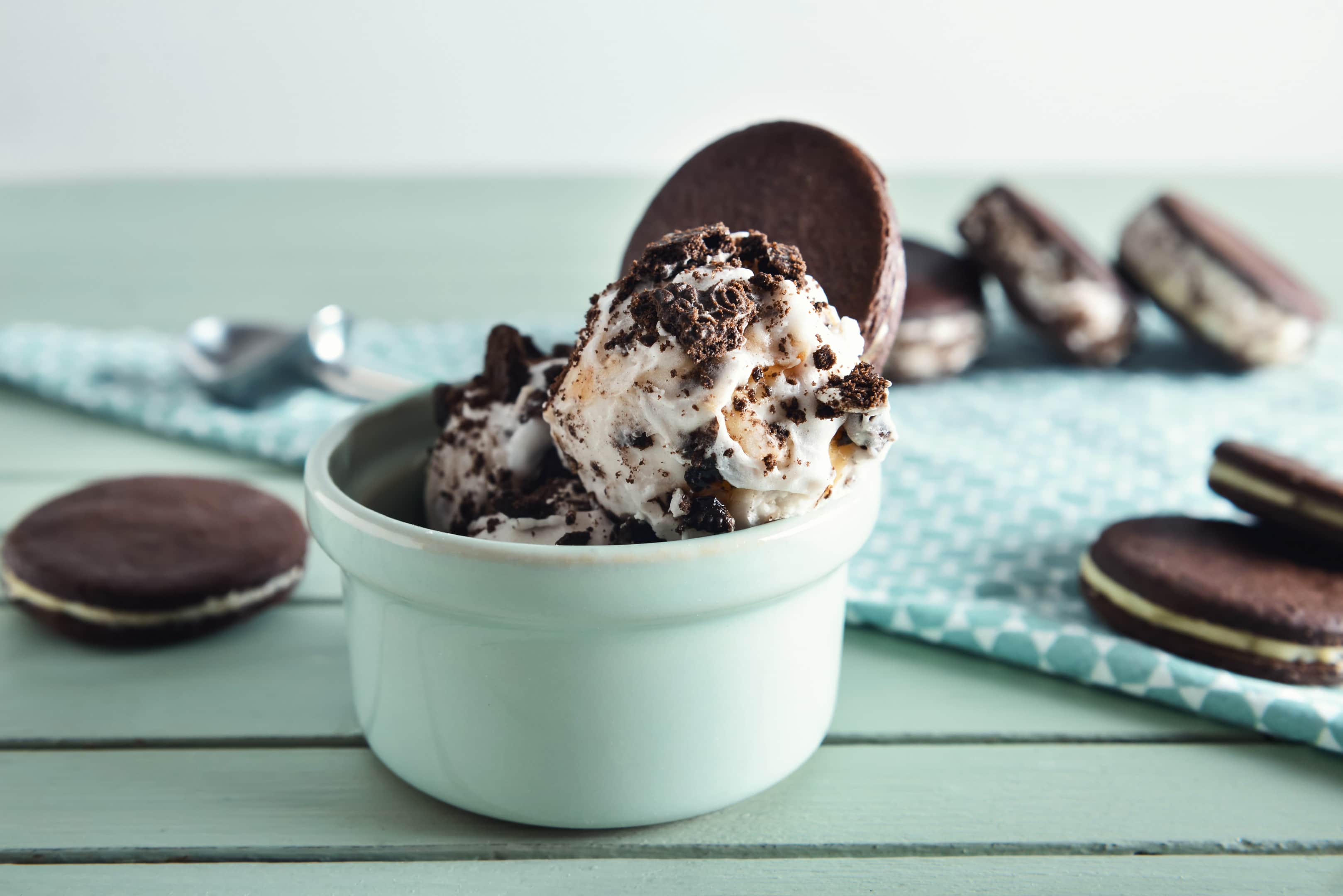 A bowl of vegan ice cream with oreo cookies