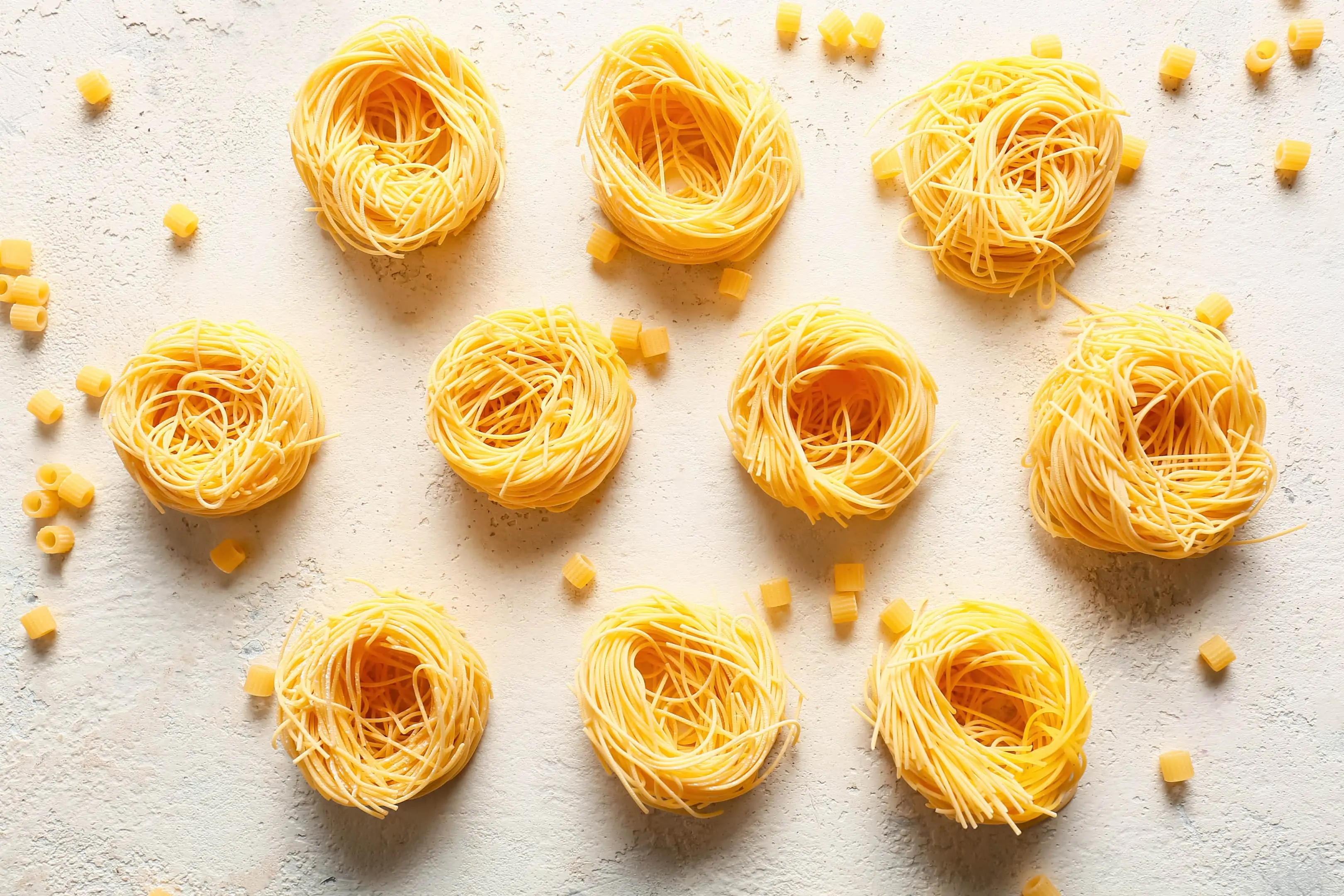 Dry pasta assortment on white background