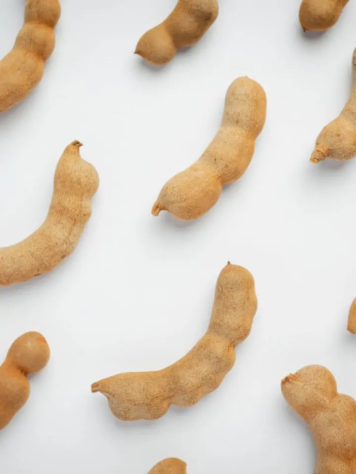 Fresh sweet ripe tamarind on white surface