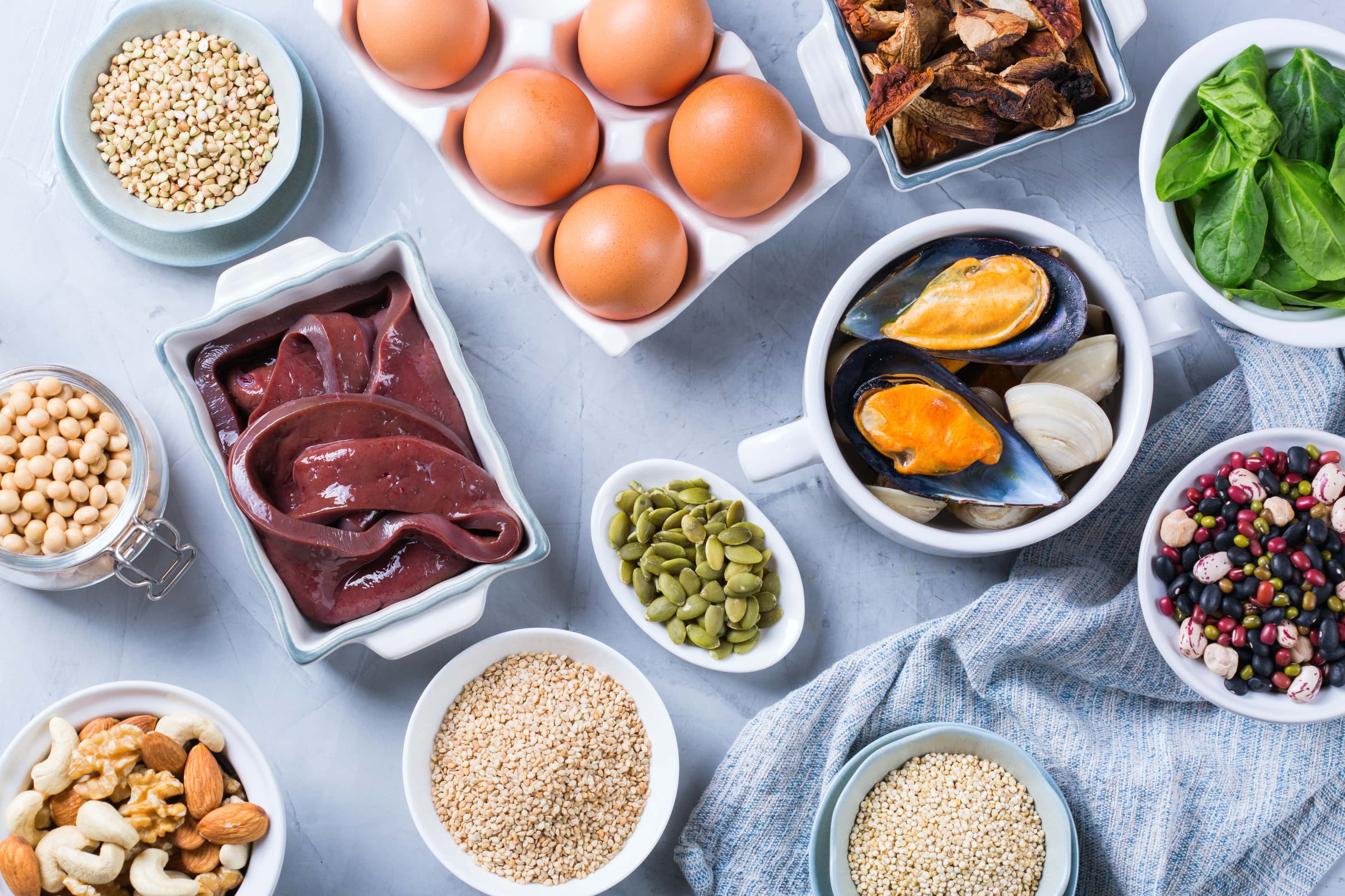 Healthy nutrition — beef liver, spinach, eggs, legumes, nuts, mushrooms, quinoa sesame, pumpkin seeds, soy beans and seafood