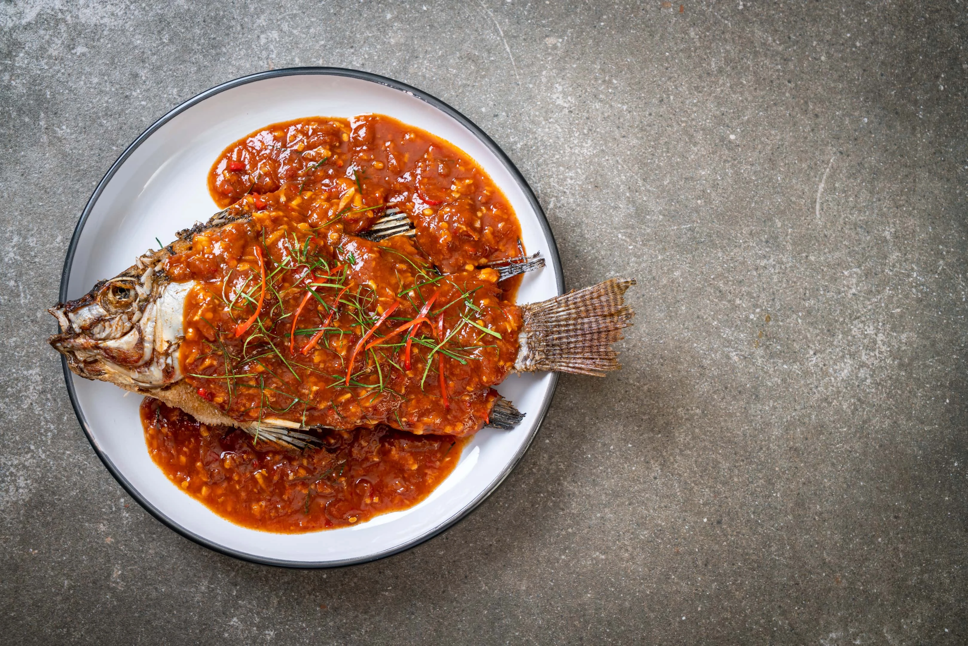 Fried fish with xo sauce. Fish is part of the food to lower creatinine.
