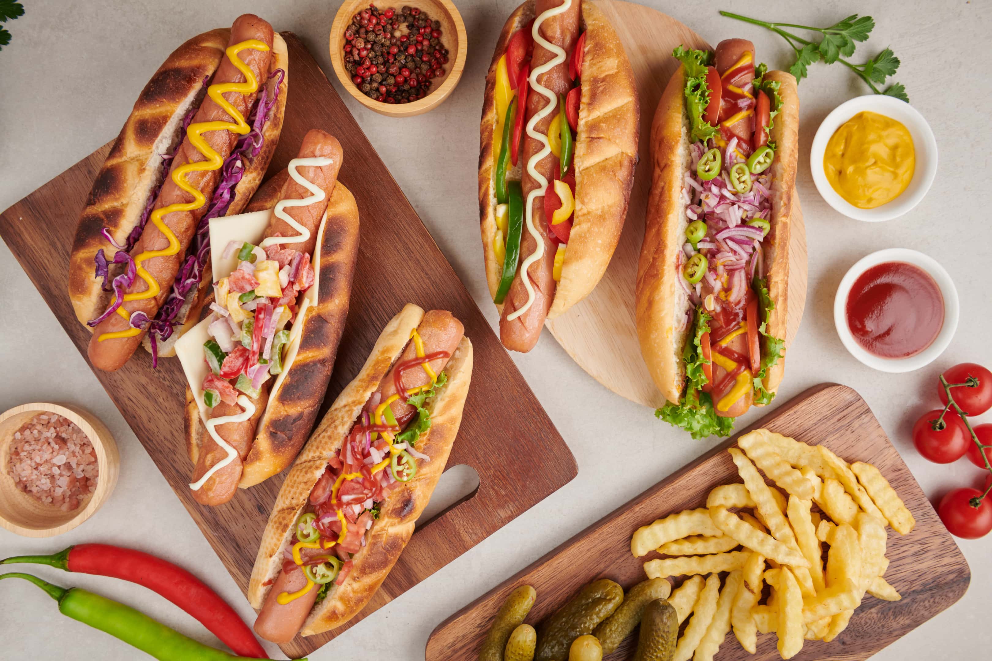 Grilled hot dog sausages with sides chips
