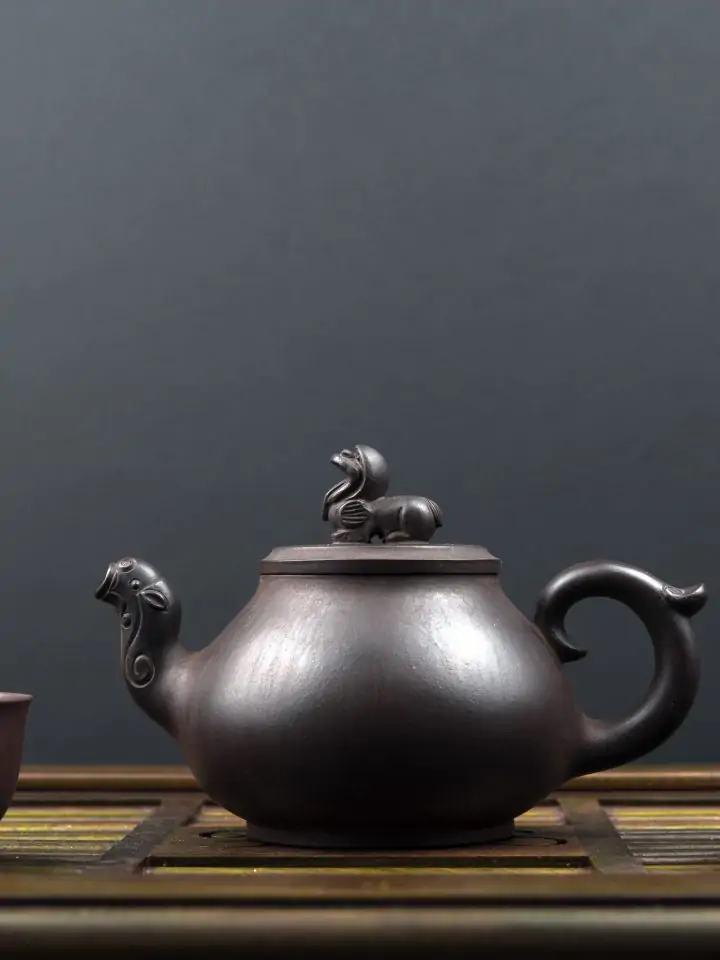 Ancient teapot with black soybean tea