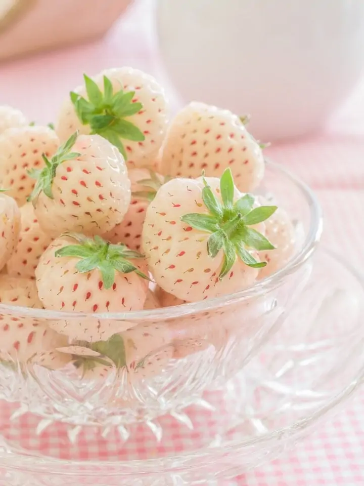 Fresh pineberries in a glass bowl