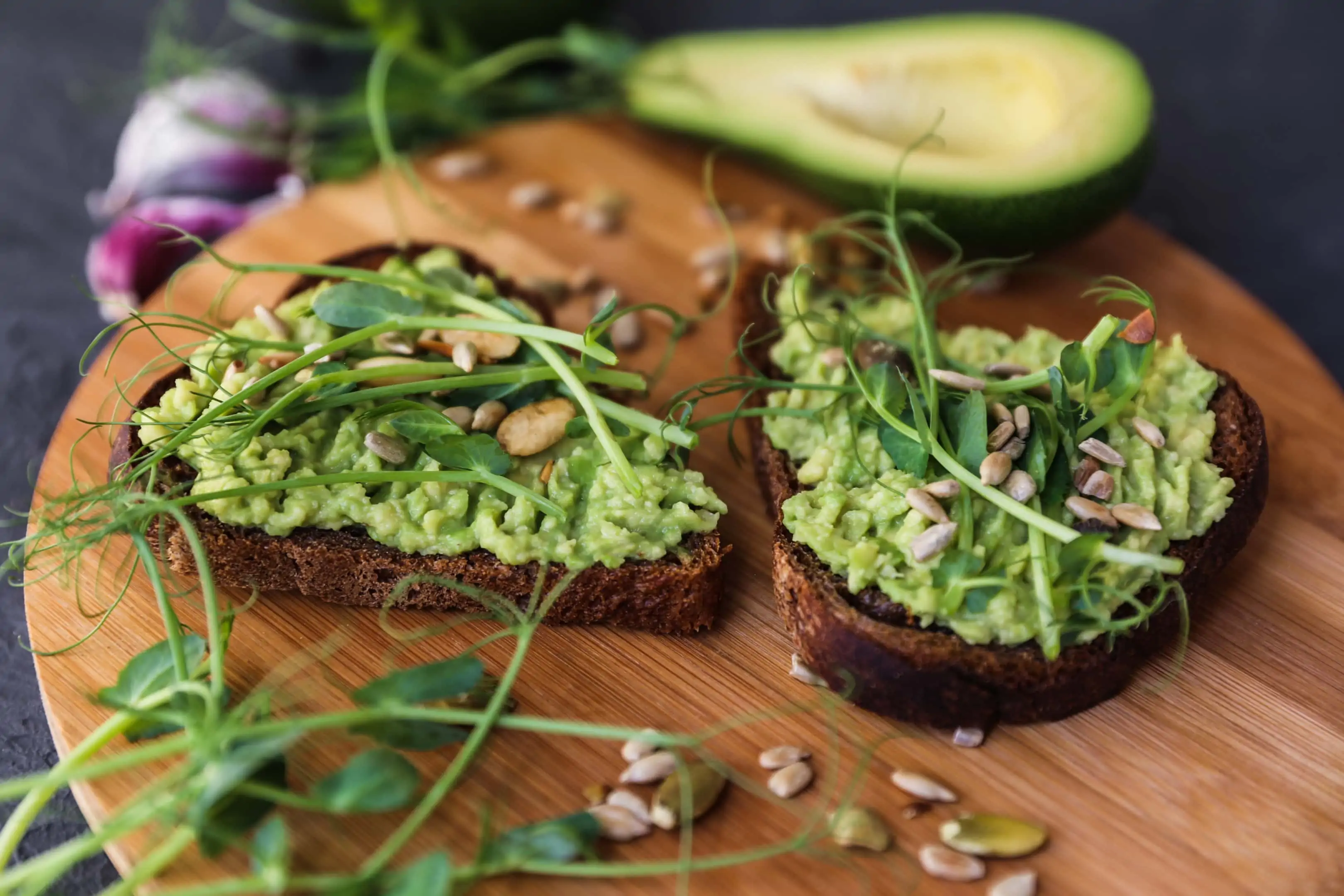 Toast with avocado and microgreens. Avocado is on our list of foods for eye cataracts.