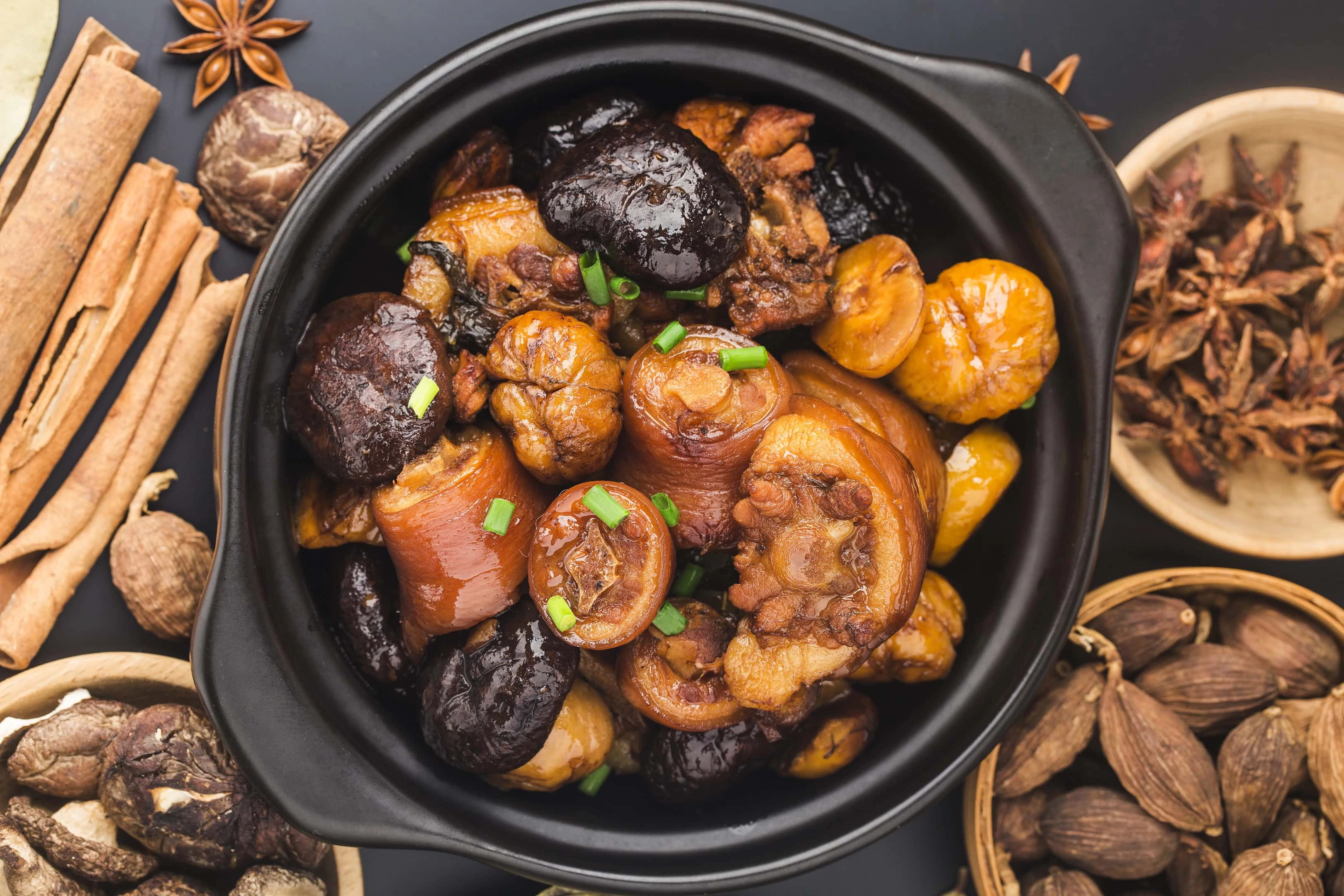 Chinese cuisine — braised chestnut pig tail with shiitake mushrooms