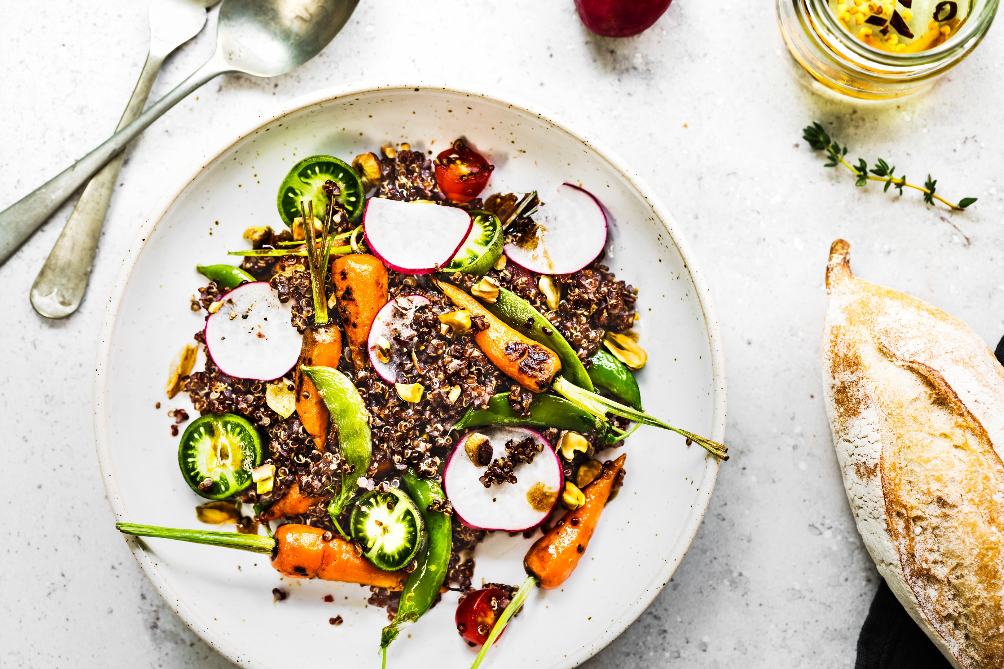 Quinoa salad with grilled baby carrot ,snap pea, radish and pistachio oil