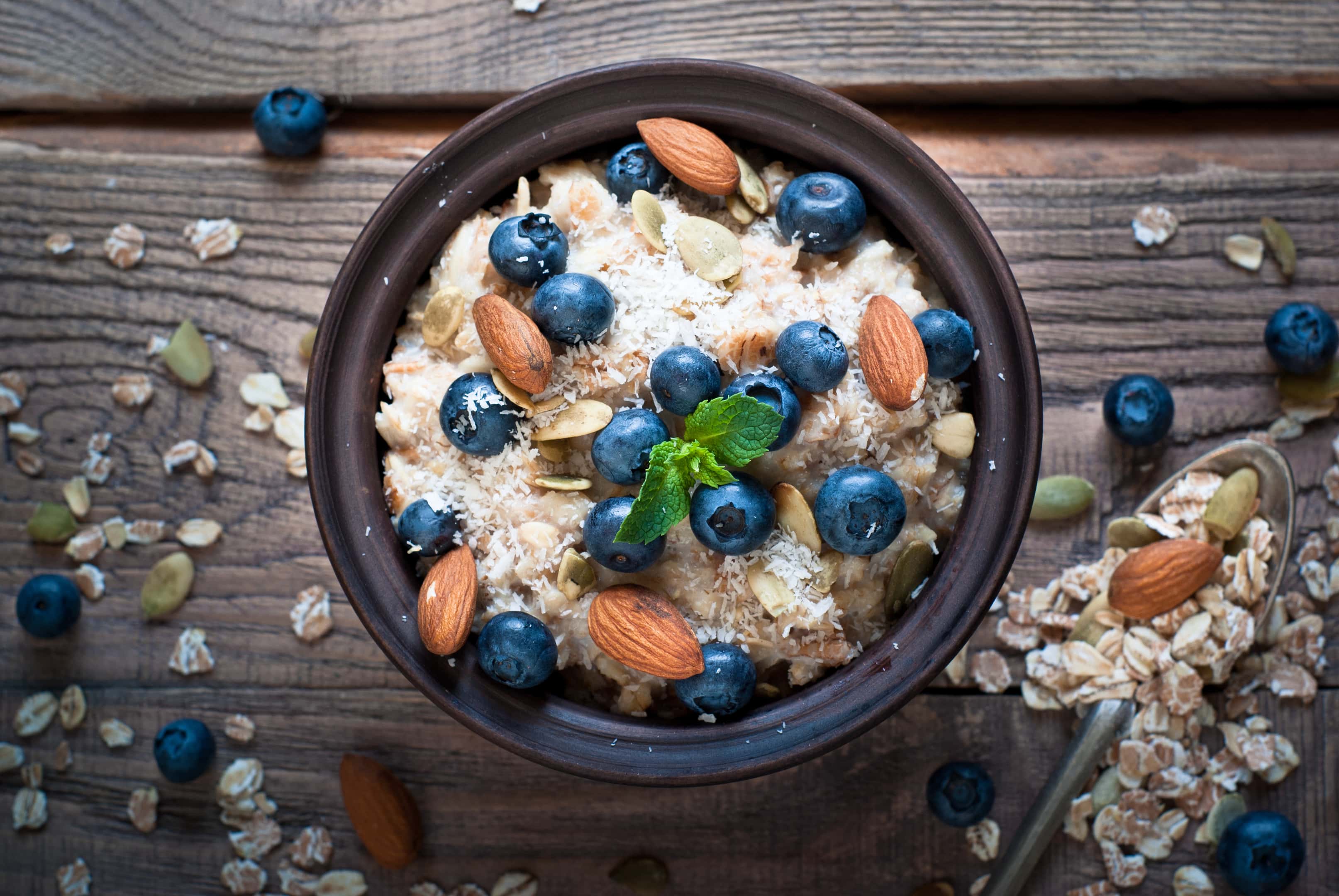 Oatmeal with blueberries, almonds, coconut and pumpkin seeds — breakfast of the dirty bulk foods