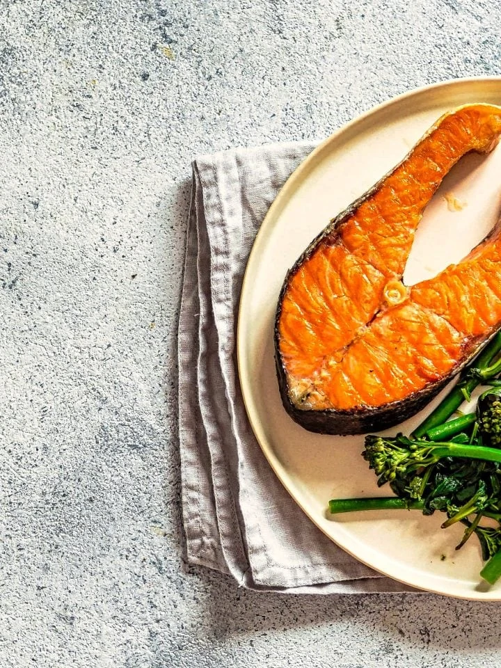 ready to eat grilled salmon steak and broccolini