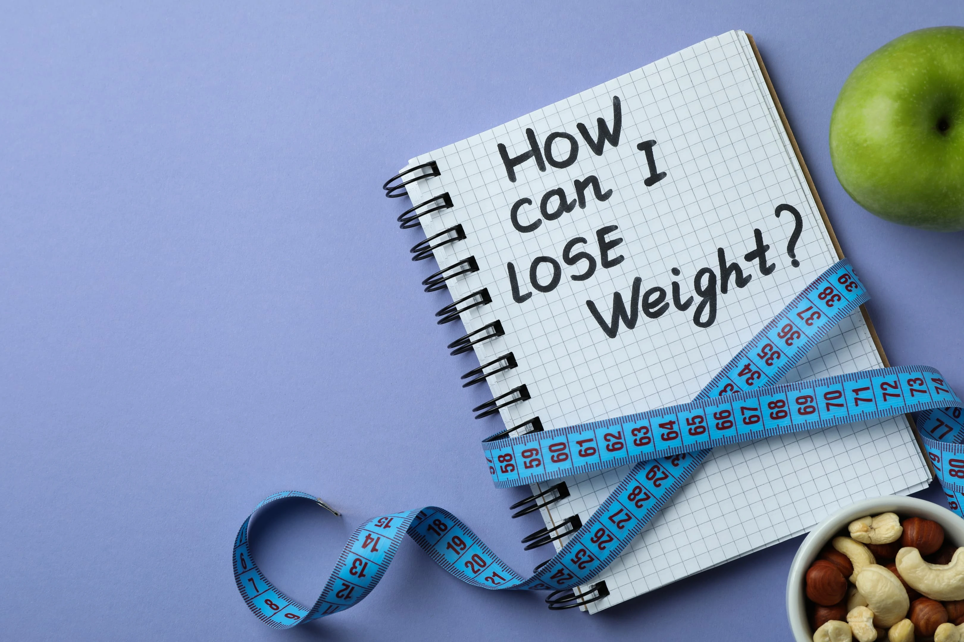 Weight loss concept on violet background