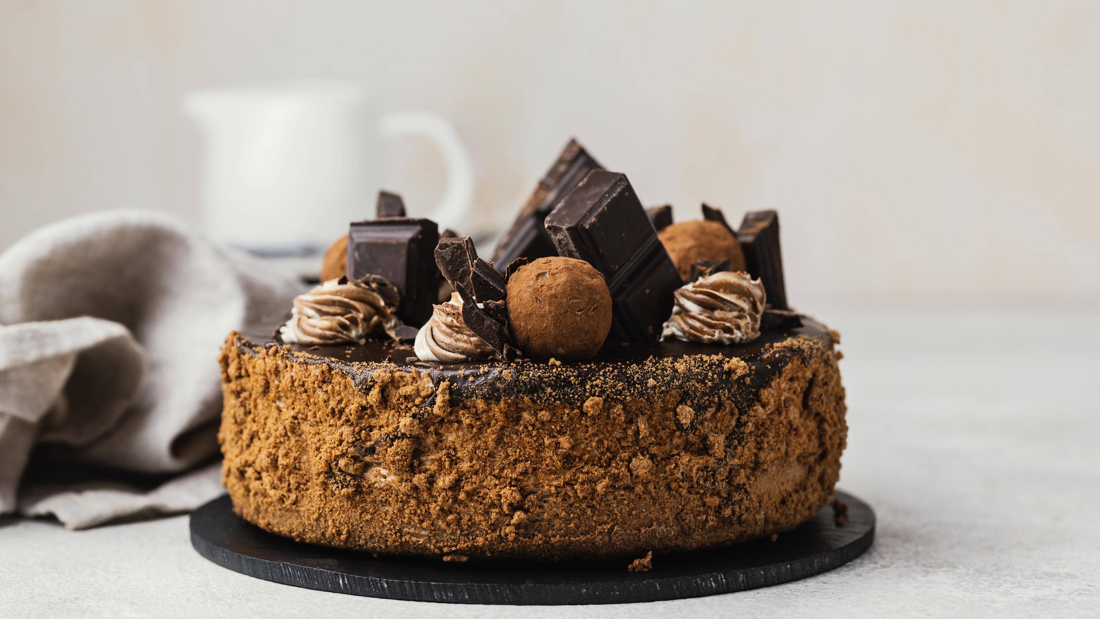 Sweet chocolate cake with chocolate truffles and chocolate cubes which are all part of the foods that make you shorter