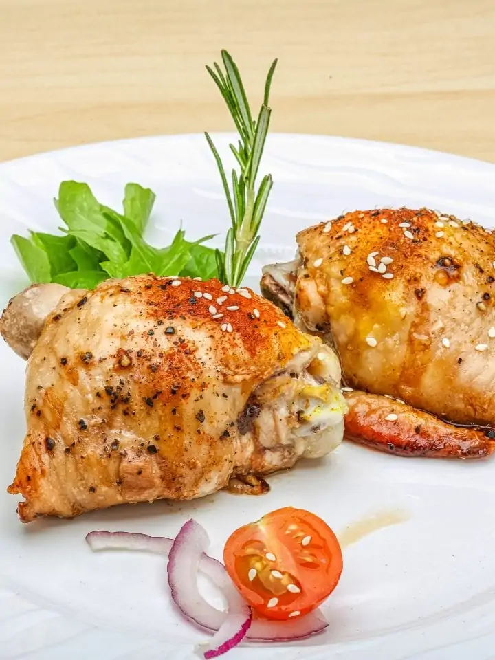 Boneless skinless chicken thighs with garnish