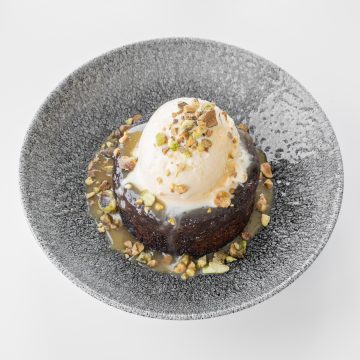 Delicious Gordon Ramsay sticky toffee pudding with garnish