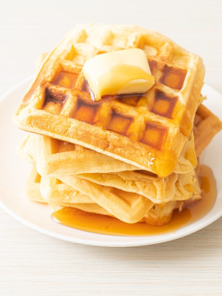 Homemade aunt Jemima waffle with butter and honey maple syrup