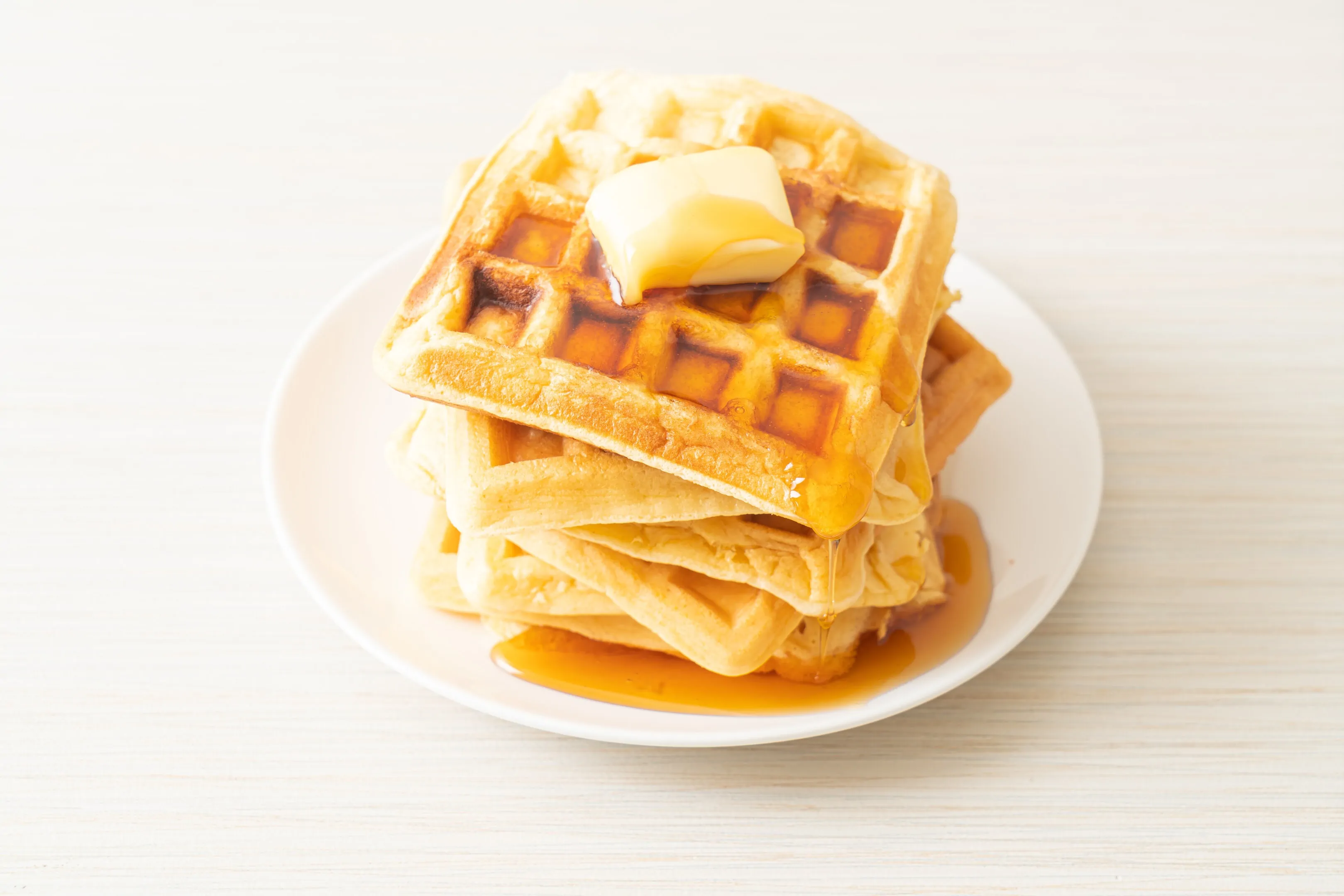Homemade Aunt Jemima waffle recipe with butter and honey maple syrup