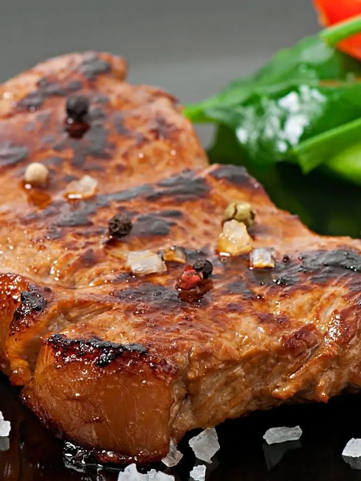 Smoking pork chop with salad