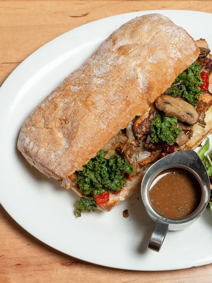 Juicy salmon cheese steak with salad and gravy