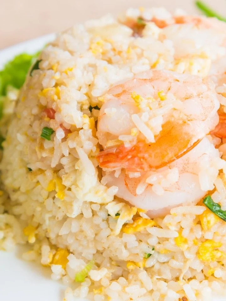 Asian inspired Din Tai Fung fried rice with shrimp, lime, and lettuce