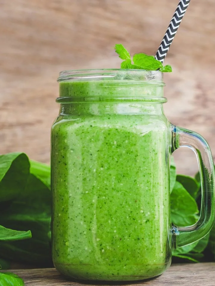 Ultimate meal replacement smoothie filled with spinach, banana, and coconut milk
