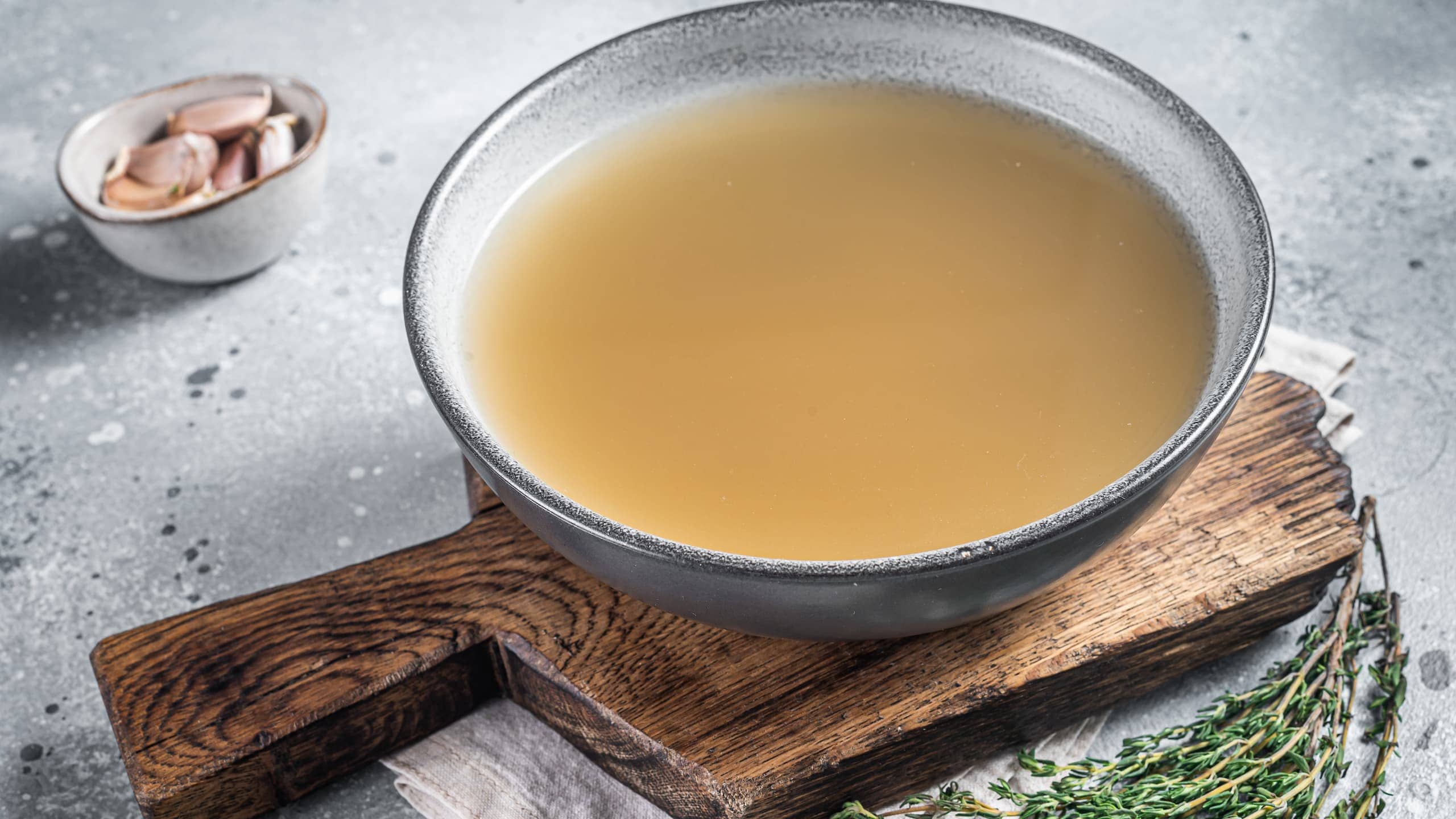 Bone broth with garlic cloves