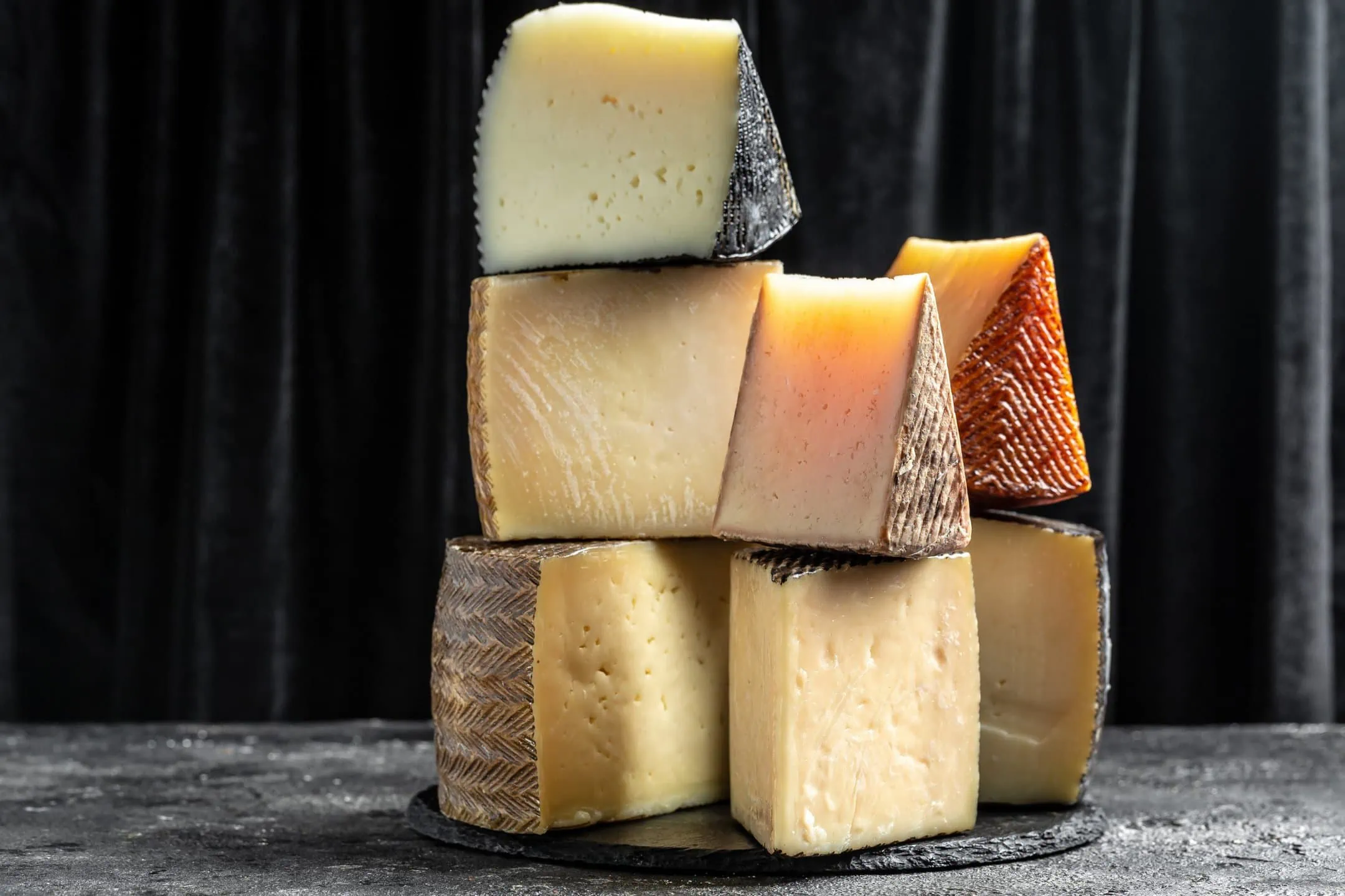 Various types of Spanish manchego cheese made from cow and goat milk.